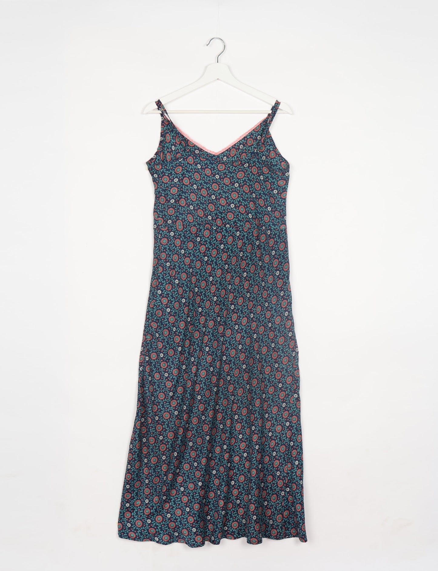 Spaghetti strap dress made from sustainable materials, embodying ethical fashion principles. Ideal for eco-friendly travelers seeking laid-back style.