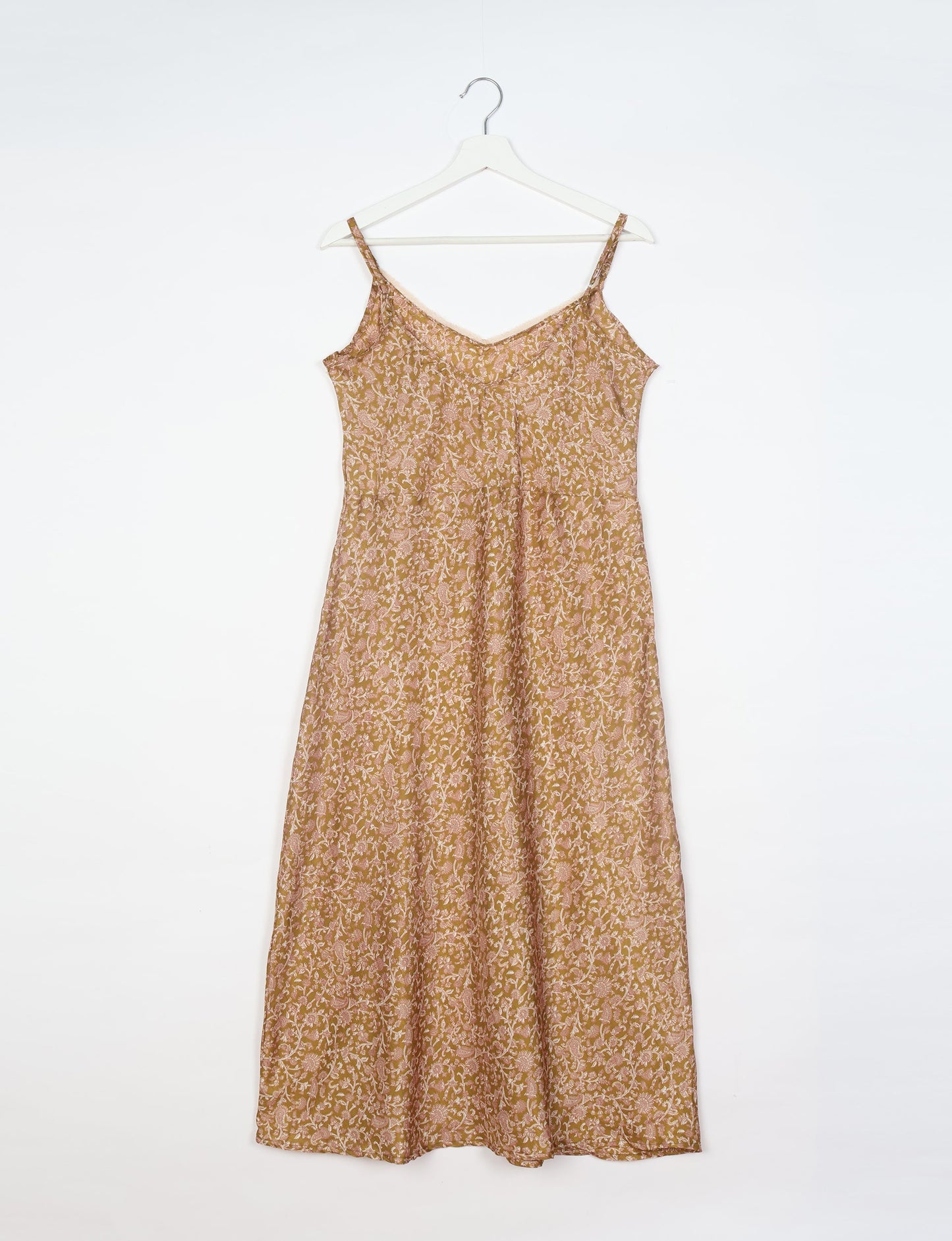 Spaghetti strap dress made from sustainable materials, embodying ethical fashion principles. Ideal for eco-friendly travelers seeking laid-back style.