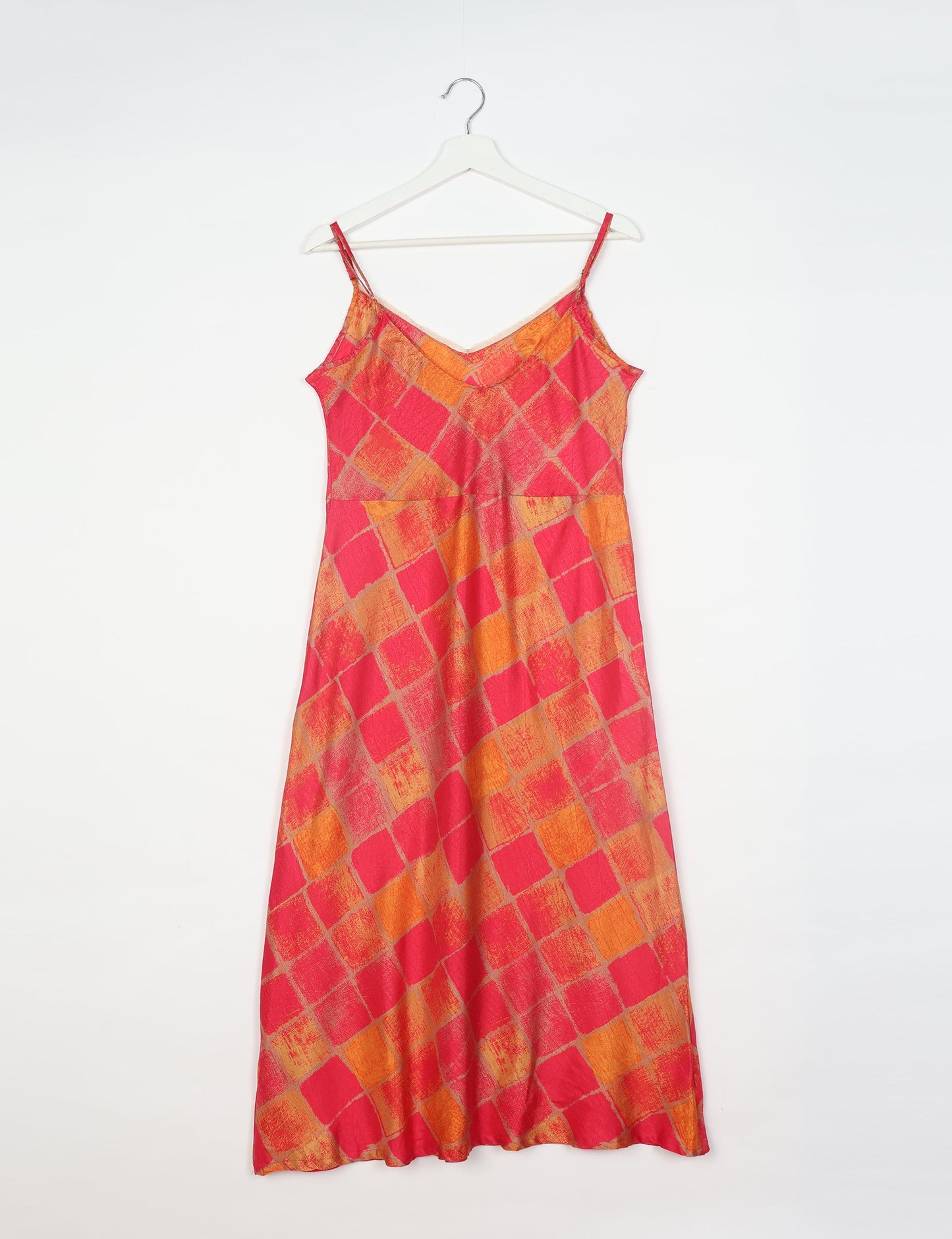 Spaghetti strap dress made from sustainable materials, embodying ethical fashion principles. Ideal for eco-friendly travelers seeking laid-back style.