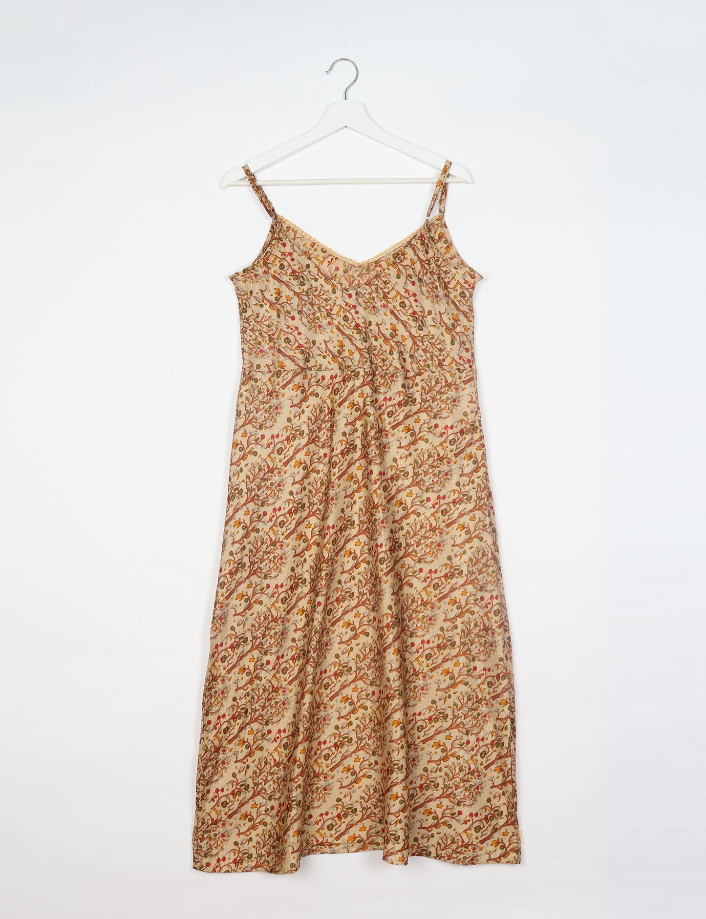 Spaghetti strap dress made from sustainable materials, embodying ethical fashion principles. Ideal for eco-friendly travelers seeking laid-back style.