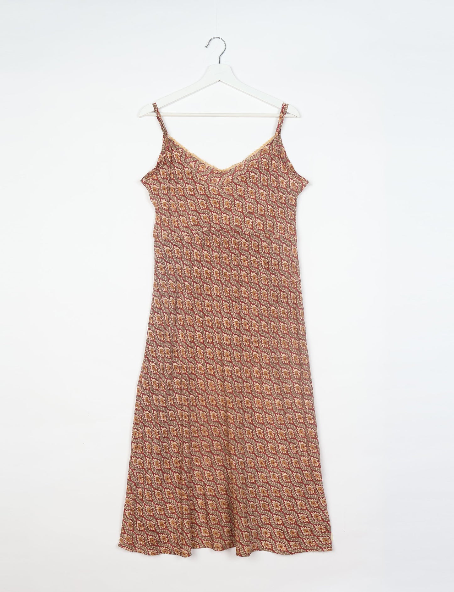 Spaghetti strap dress made from sustainable materials, embodying ethical fashion principles. Ideal for eco-friendly travelers seeking laid-back style.