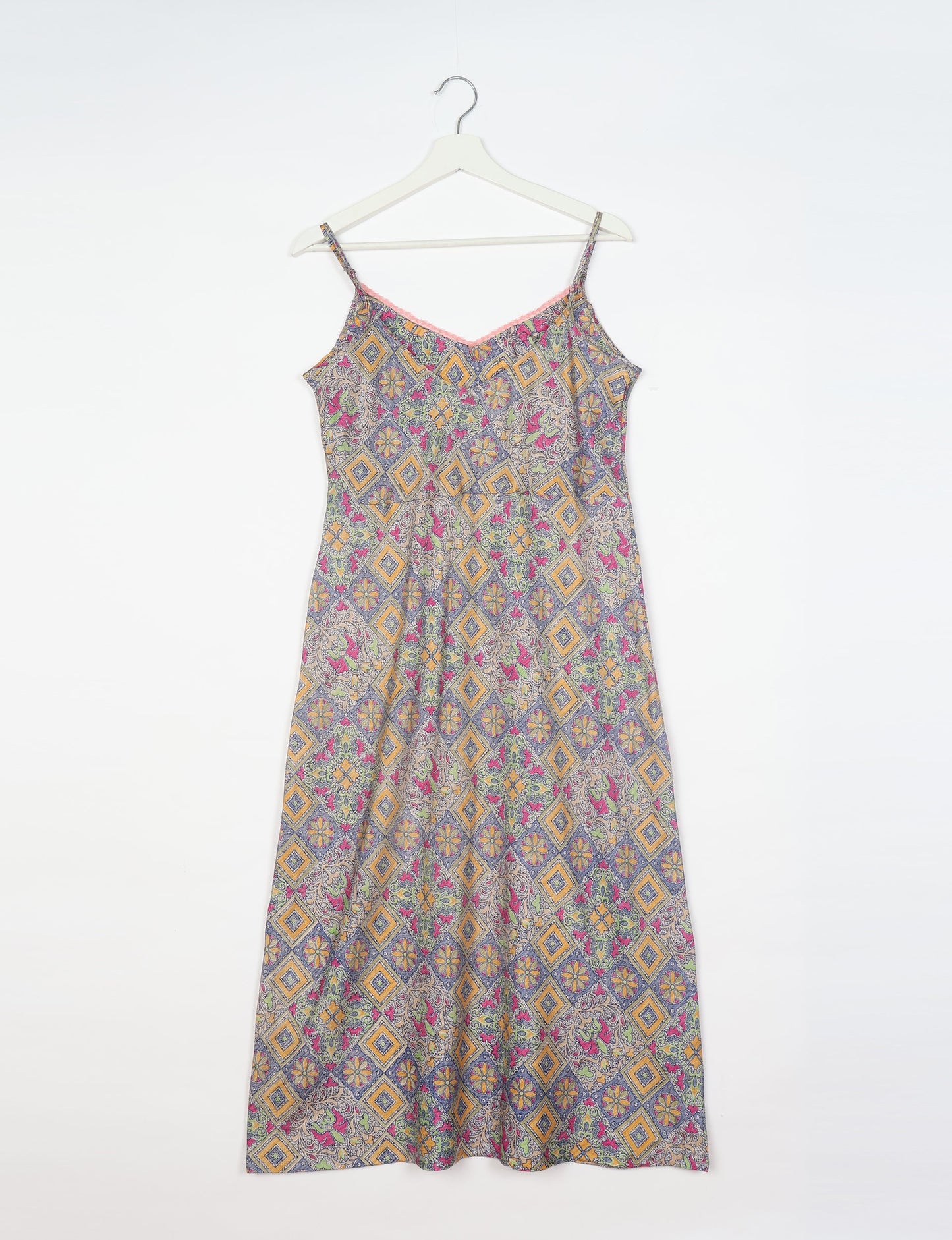 Spaghetti strap dress made from sustainable materials, embodying ethical fashion principles. Ideal for eco-friendly travelers seeking laid-back style.