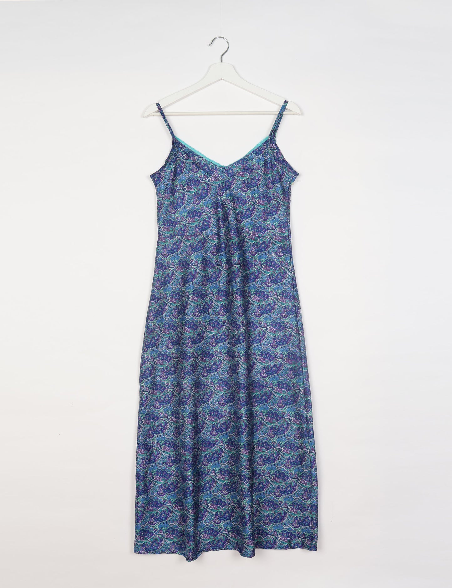 Spaghetti strap dress made from sustainable materials, embodying ethical fashion principles. Ideal for eco-friendly travelers seeking laid-back style.