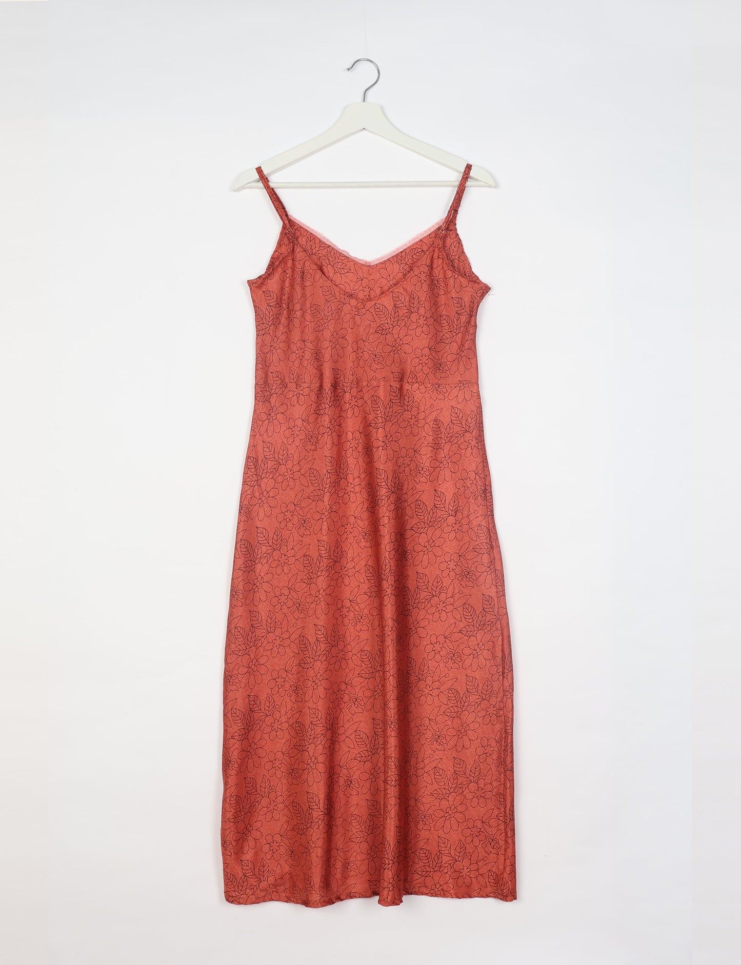Spaghetti strap dress made from sustainable materials, embodying ethical fashion principles. Ideal for eco-friendly travelers seeking laid-back style.
