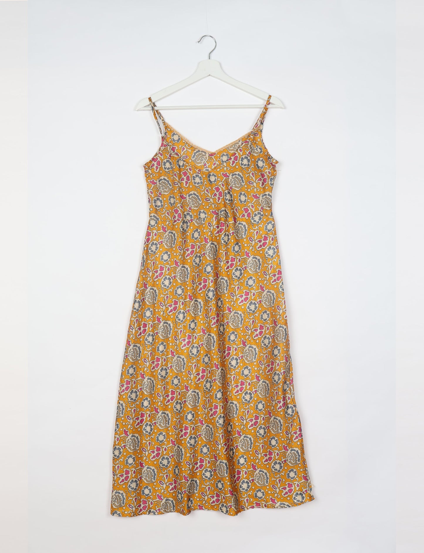 Spaghetti strap dress made from sustainable materials, embodying ethical fashion principles. Ideal for eco-friendly travelers seeking laid-back style.