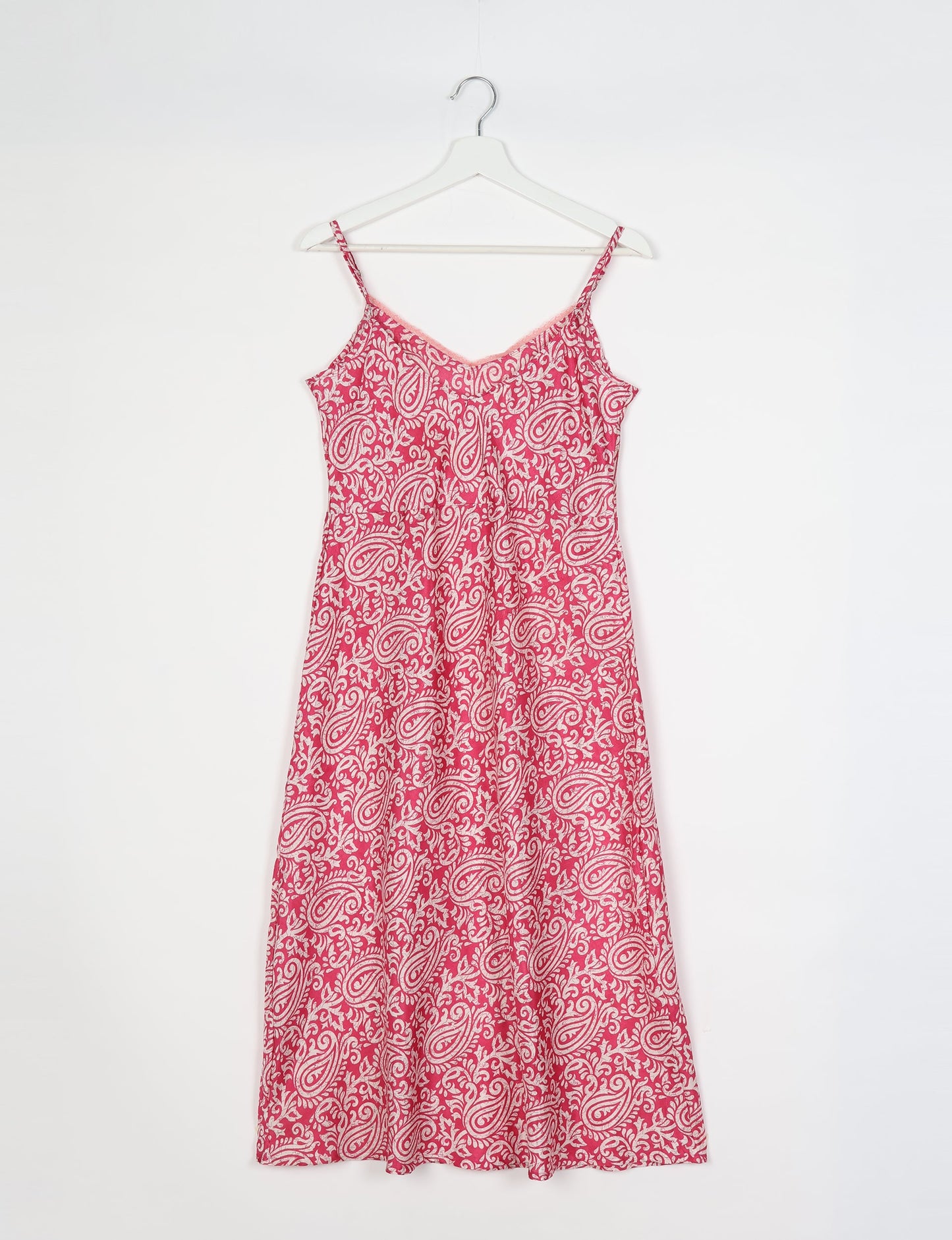 Spaghetti strap dress made from sustainable materials, embodying ethical fashion principles. Ideal for eco-friendly travelers seeking laid-back style.