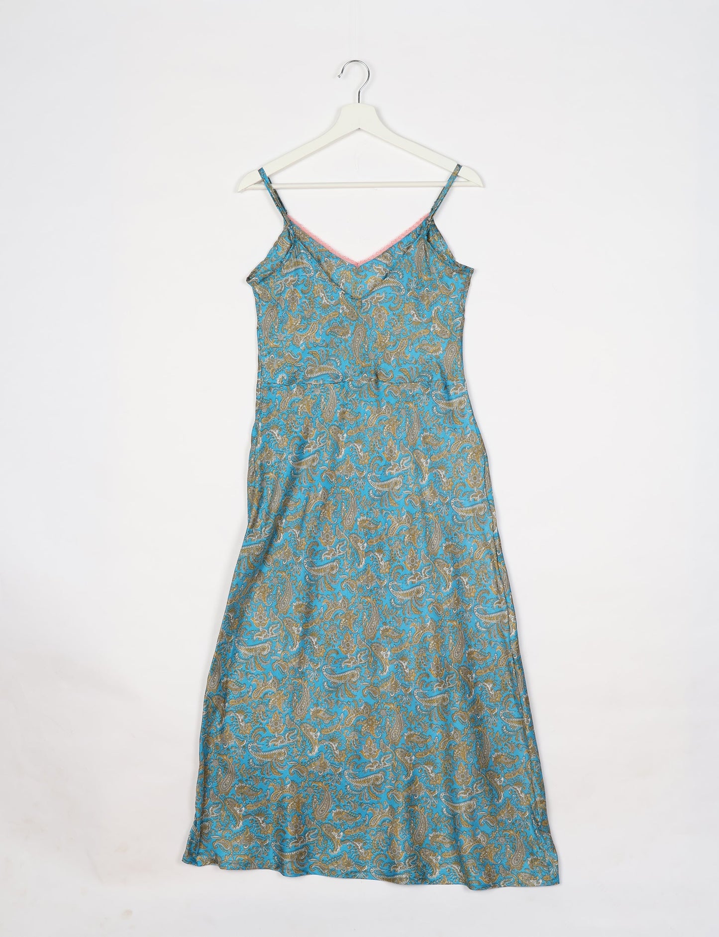 Spaghetti strap dress made from sustainable materials, embodying ethical fashion principles. Ideal for eco-friendly travelers seeking laid-back style.