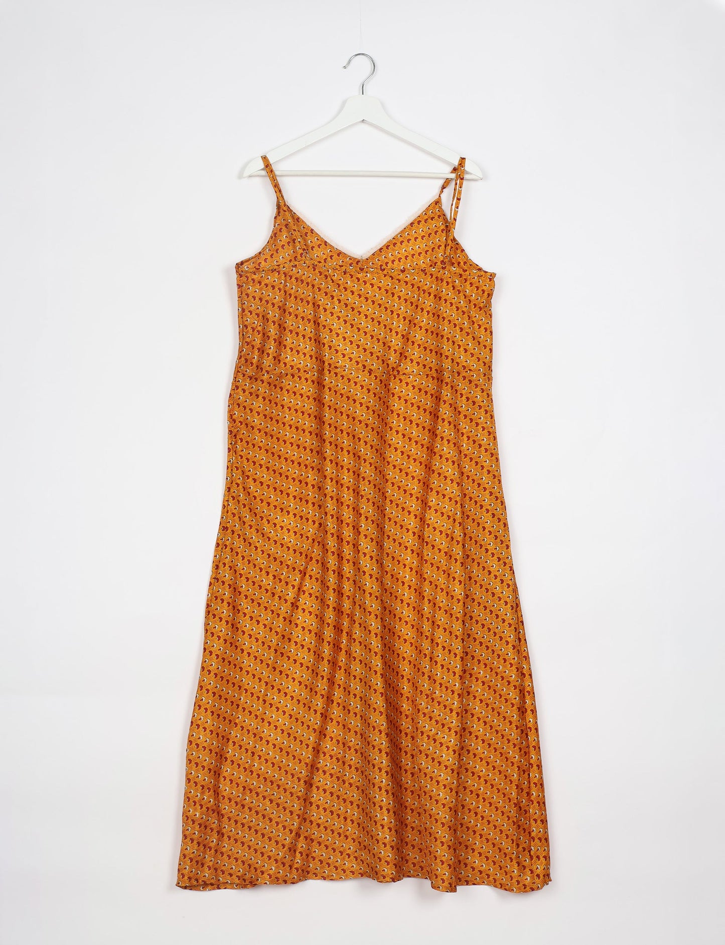 Spaghetti strap dress made from sustainable materials, embodying ethical fashion principles. Ideal for eco-friendly travelers seeking laid-back style.