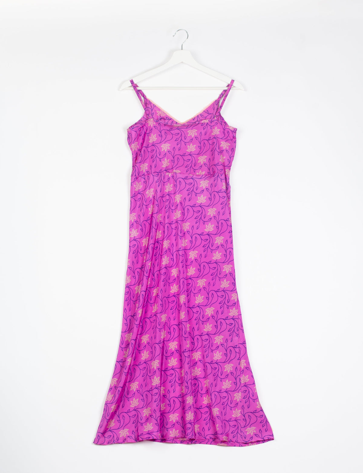 Spaghetti strap dress made from sustainable materials, embodying ethical fashion principles. Ideal for eco-friendly travelers seeking laid-back style.