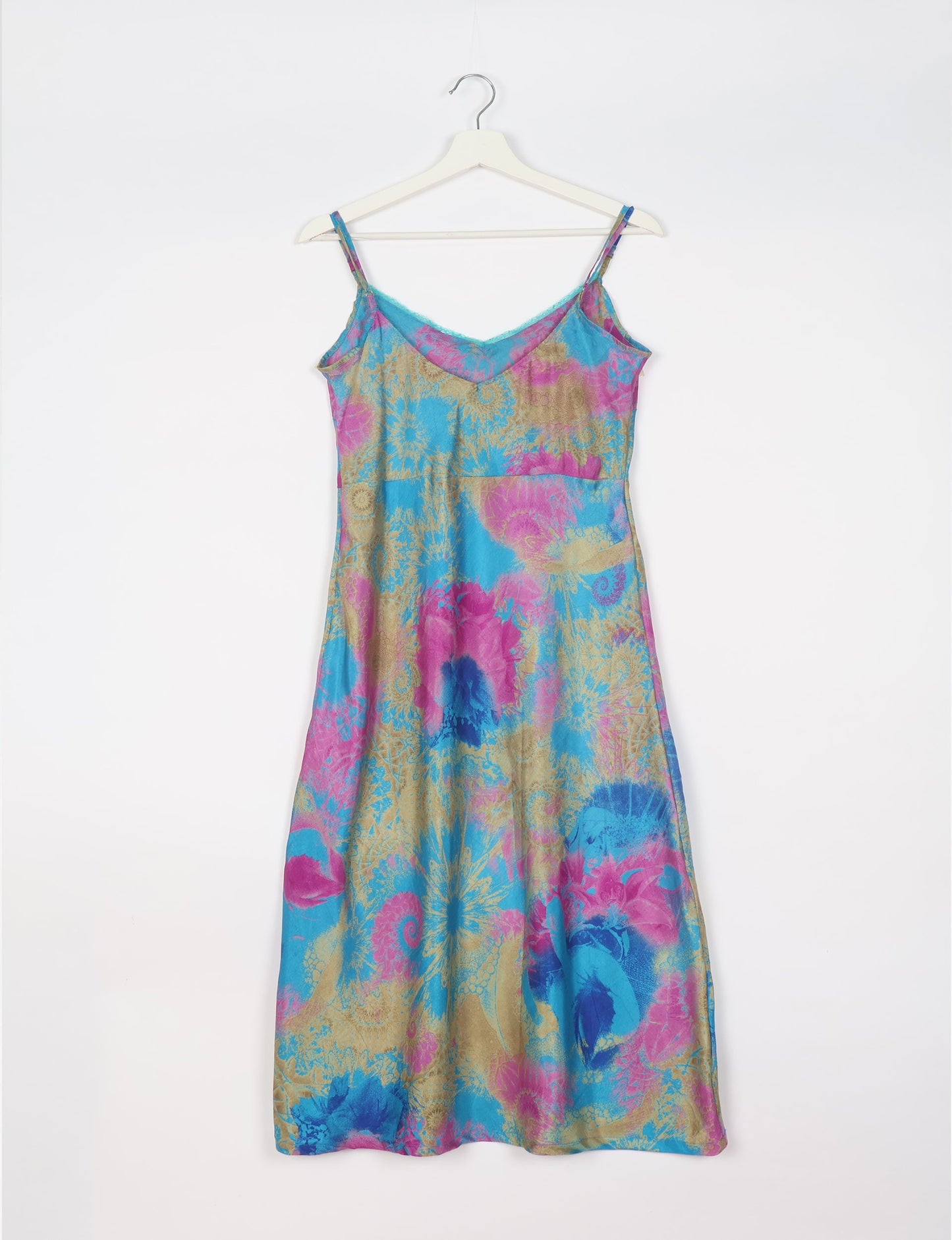 Spaghetti strap dress made from sustainable materials, embodying ethical fashion principles. Ideal for eco-friendly travelers seeking laid-back style.