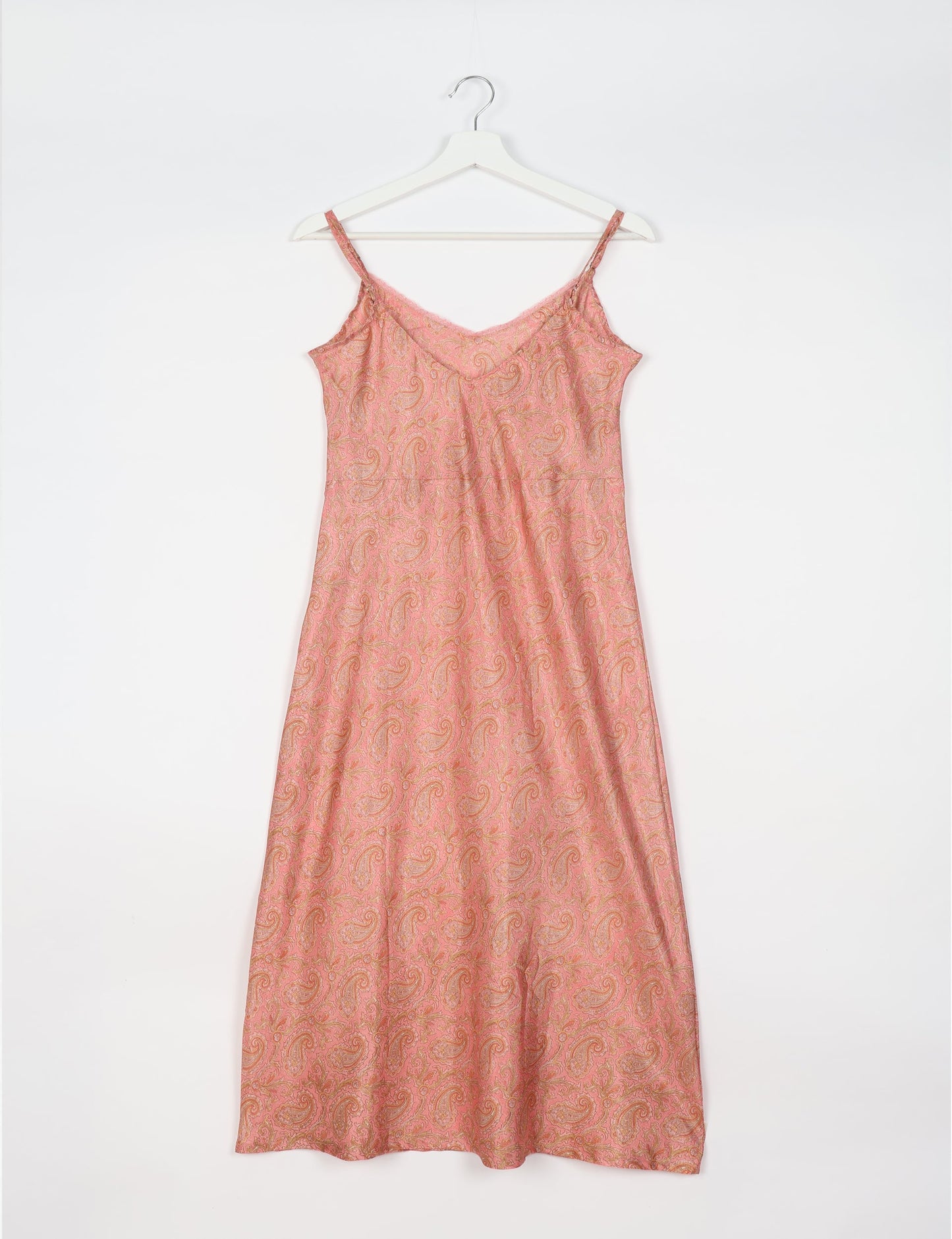 Spaghetti strap dress made from sustainable materials, embodying ethical fashion principles. Ideal for eco-friendly travelers seeking laid-back style.