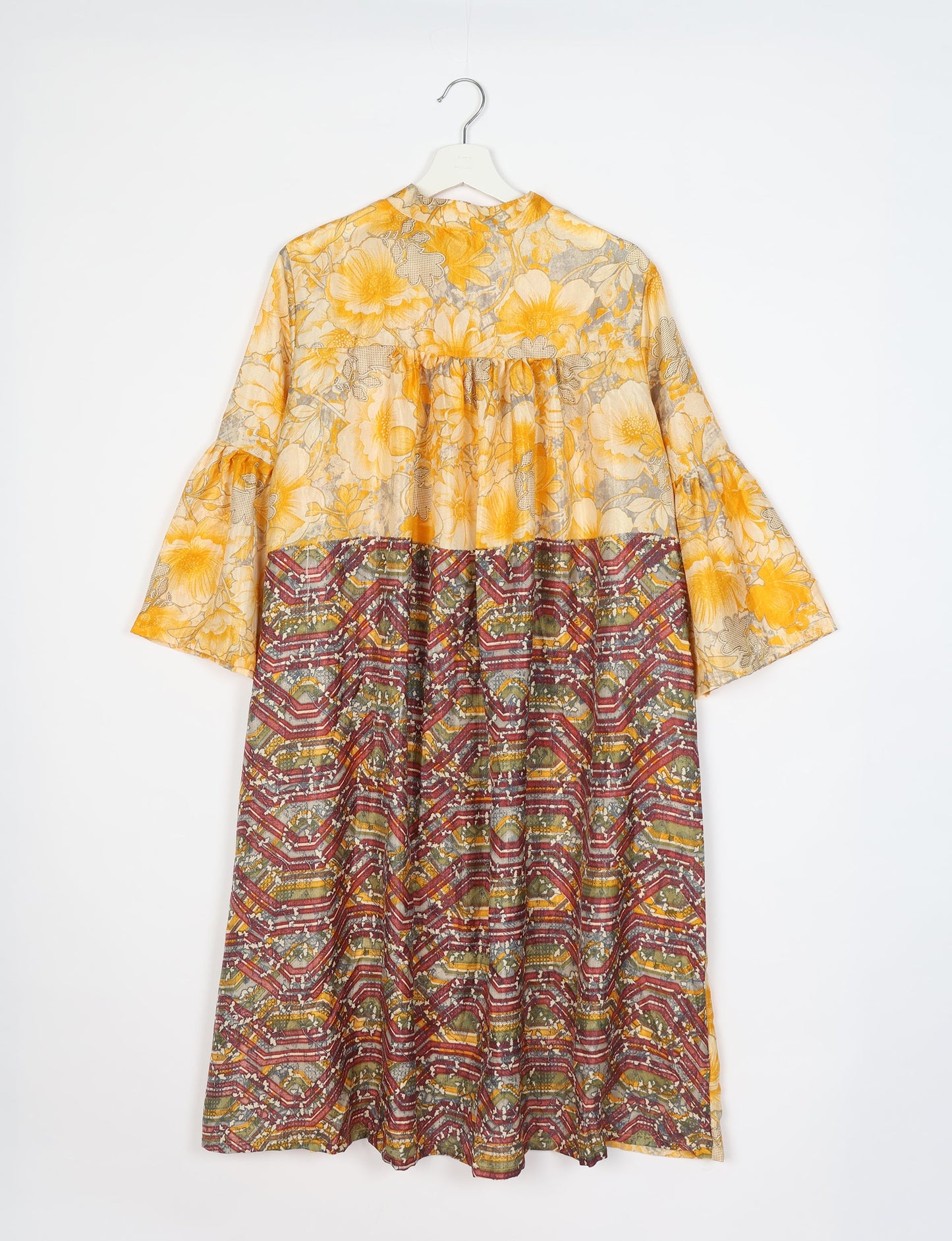 Discover ethical elegance with our Bell Sleeve Coat, handcrafted by Indian artisans from recycled materials. This sustainable fashion piece is a statement in eco-friendly clothing, combining style and consciousness effortlessly.