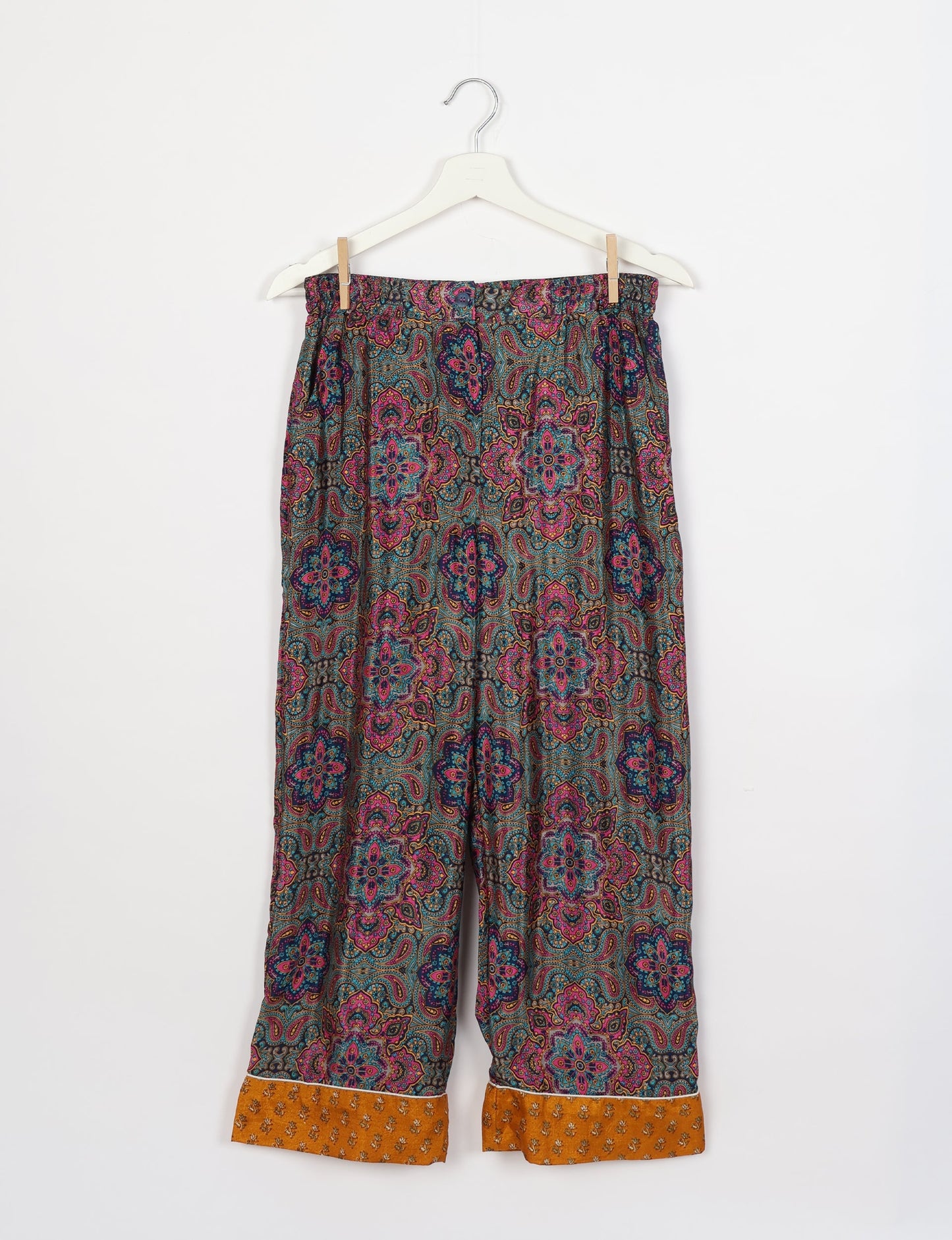 Chic long-sleeve pajama set made from recycled materials, representing eco friendly products, repurposed clothing, and zero waste clothing in green fashion.