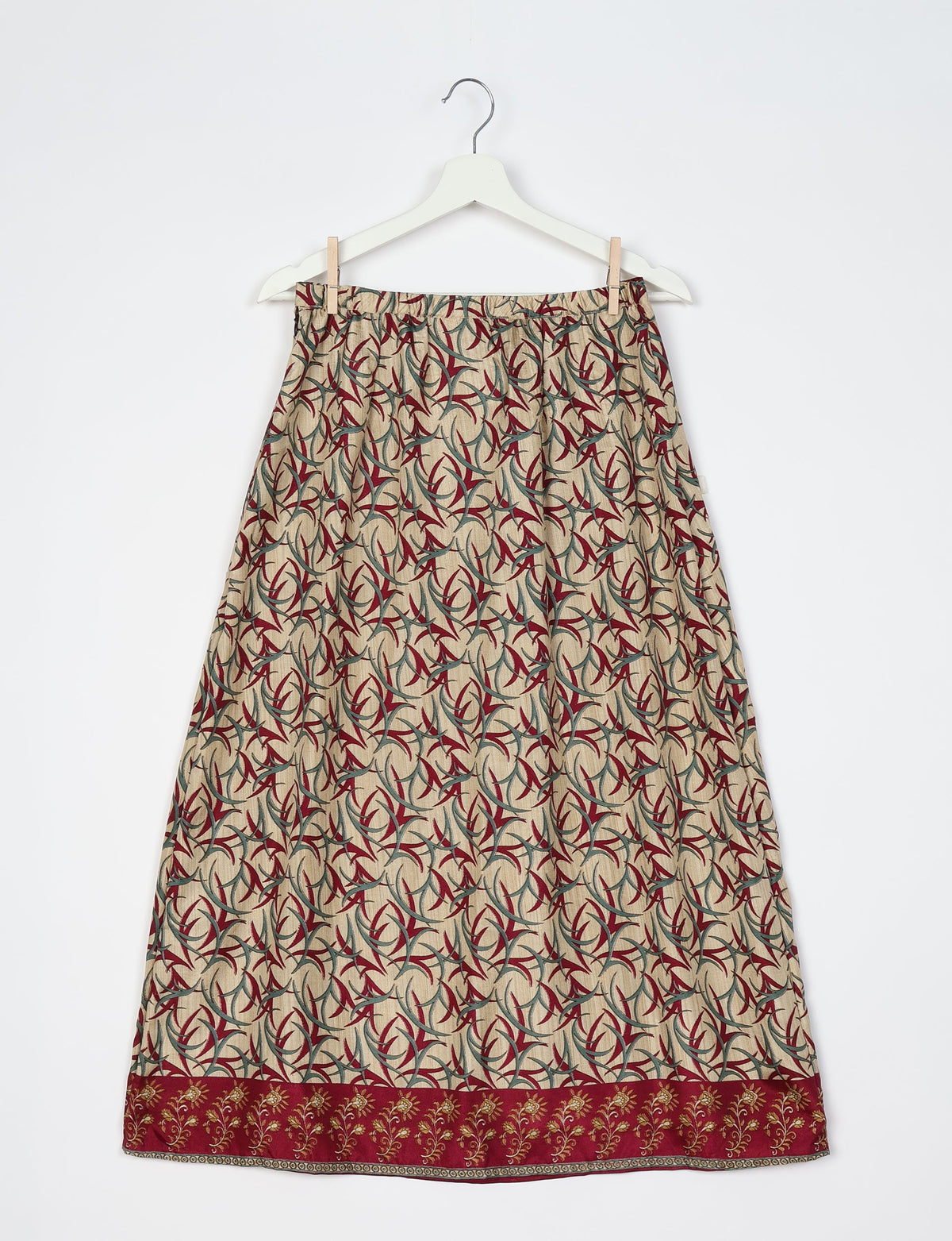 Sustainable A LINE SKIRT, a high-fashion choice for conscious individuals. Fitted at the waist, ankle-length, and ethically crafted for eco-friendly style.