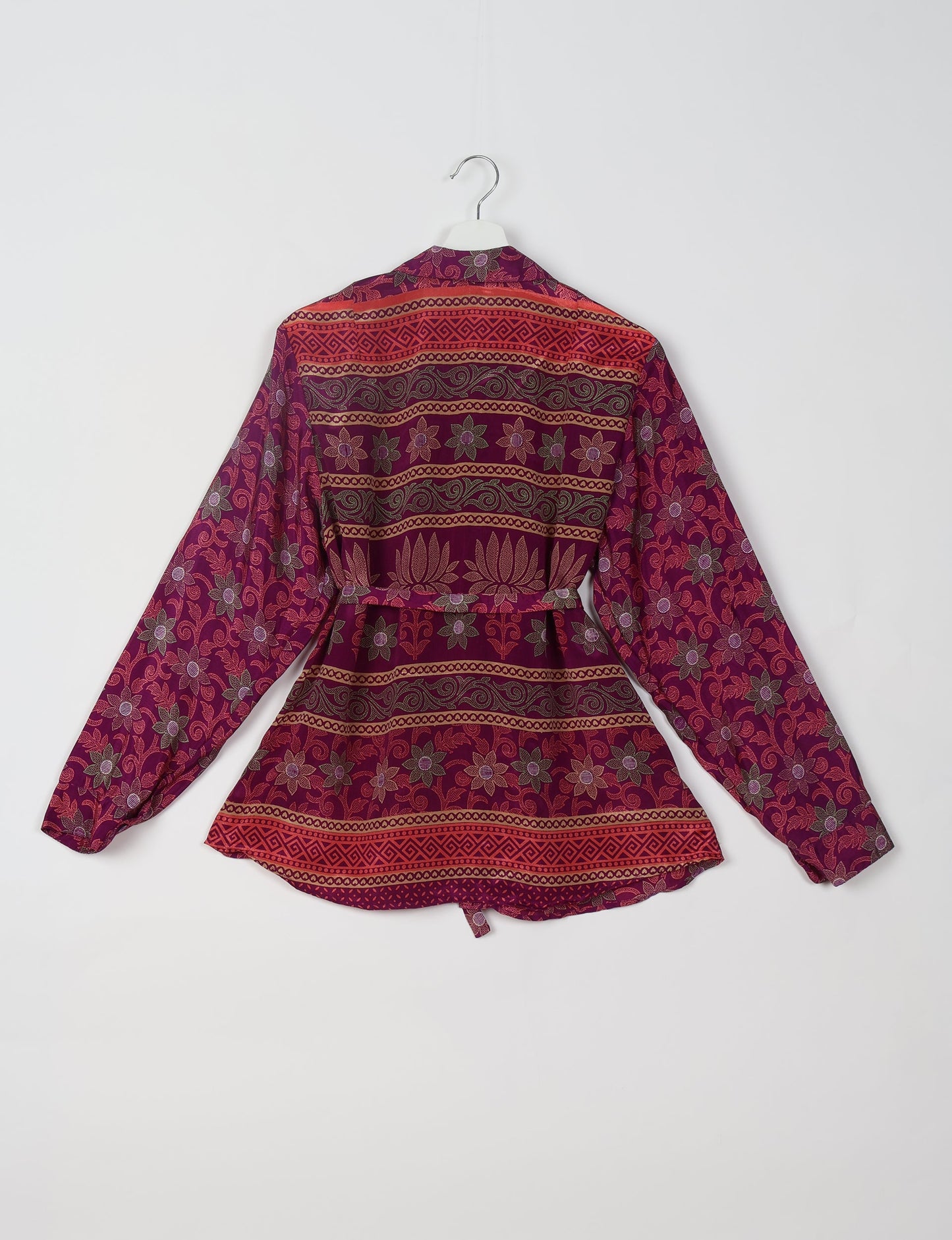 Experience sustainable fashion with our classic slim-fit shirt, crafted with ethical and green values. The shirt, designed for minimal waste, features a tie-up waist belt or neck tie, semi-spread collar, and regular shirt cuffs. Versatile and eco-friendly, wear it tucked in, unbuttoned over a tank top, or knotted at the waist for a unique style.