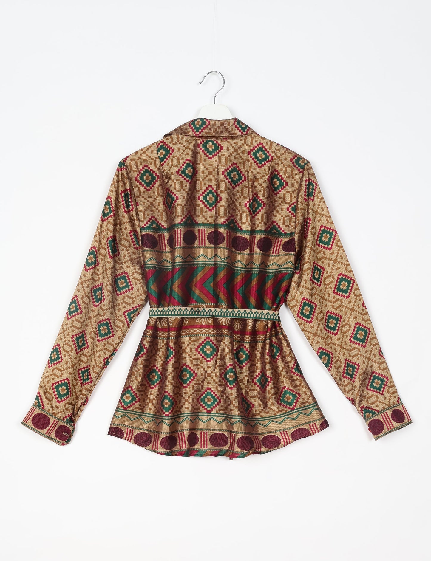 Experience sustainable fashion with our classic slim-fit shirt, crafted with ethical and green values. The shirt, designed for minimal waste, features a tie-up waist belt or neck tie, semi-spread collar, and regular shirt cuffs. Versatile and eco-friendly, wear it tucked in, unbuttoned over a tank top, or knotted at the waist for a unique style.