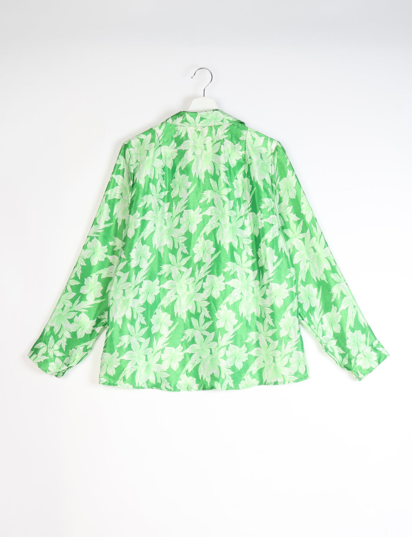 Experience sustainable fashion with our classic slim-fit shirt, crafted with ethical and green values. The shirt, designed for minimal waste, features a tie-up waist belt or neck tie, semi-spread collar, and regular shirt cuffs. Versatile and eco-friendly, wear it tucked in, unbuttoned over a tank top, or knotted at the waist for a unique style.