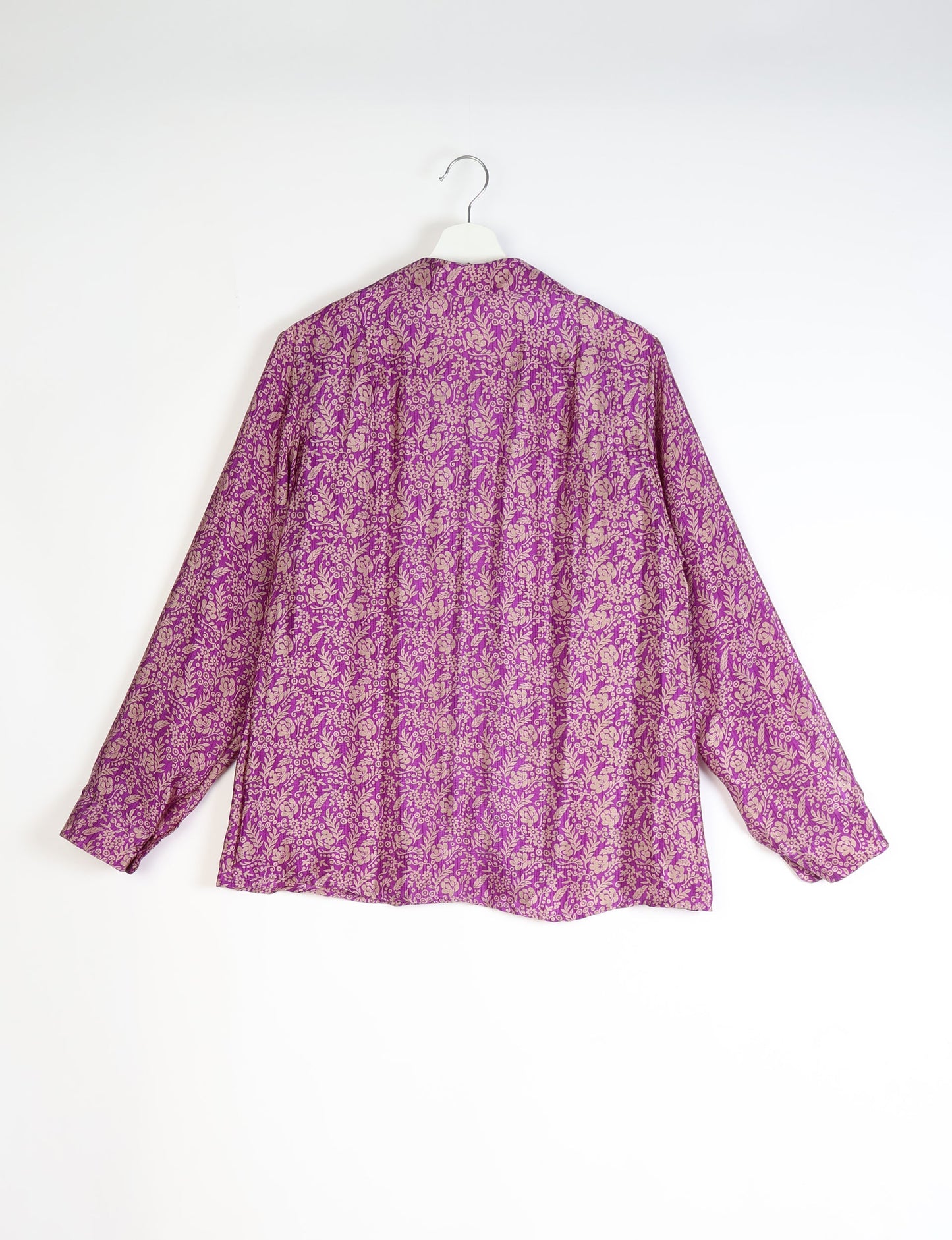 Experience sustainable fashion with our classic slim-fit shirt, crafted with ethical and green values. The shirt, designed for minimal waste, features a tie-up waist belt or neck tie, semi-spread collar, and regular shirt cuffs. Versatile and eco-friendly, wear it tucked in, unbuttoned over a tank top, or knotted at the waist for a unique style.