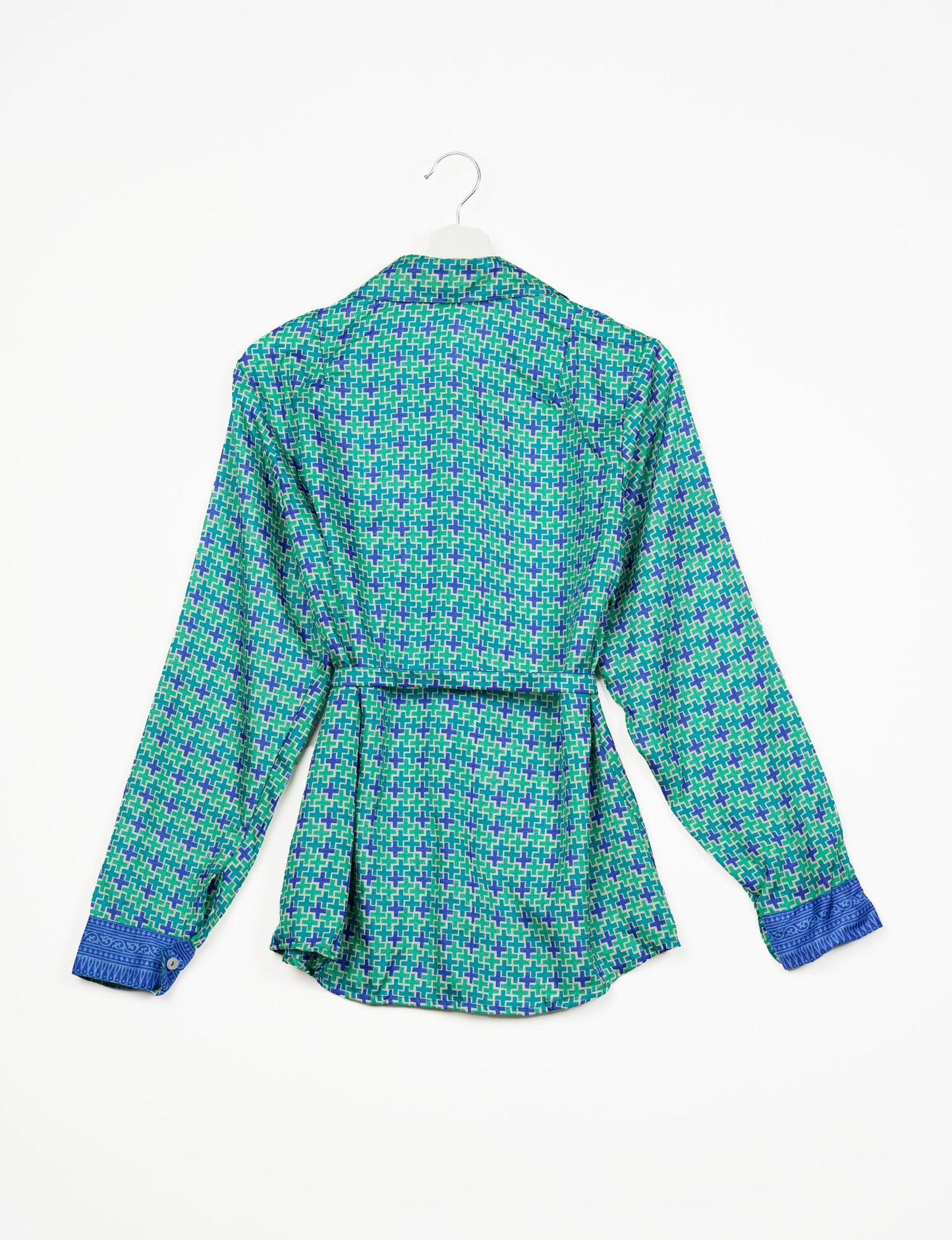 Experience sustainable fashion with our classic slim-fit shirt, crafted with ethical and green values. The shirt, designed for minimal waste, features a tie-up waist belt or neck tie, semi-spread collar, and regular shirt cuffs. Versatile and eco-friendly, wear it tucked in, unbuttoned over a tank top, or knotted at the waist for a unique style.