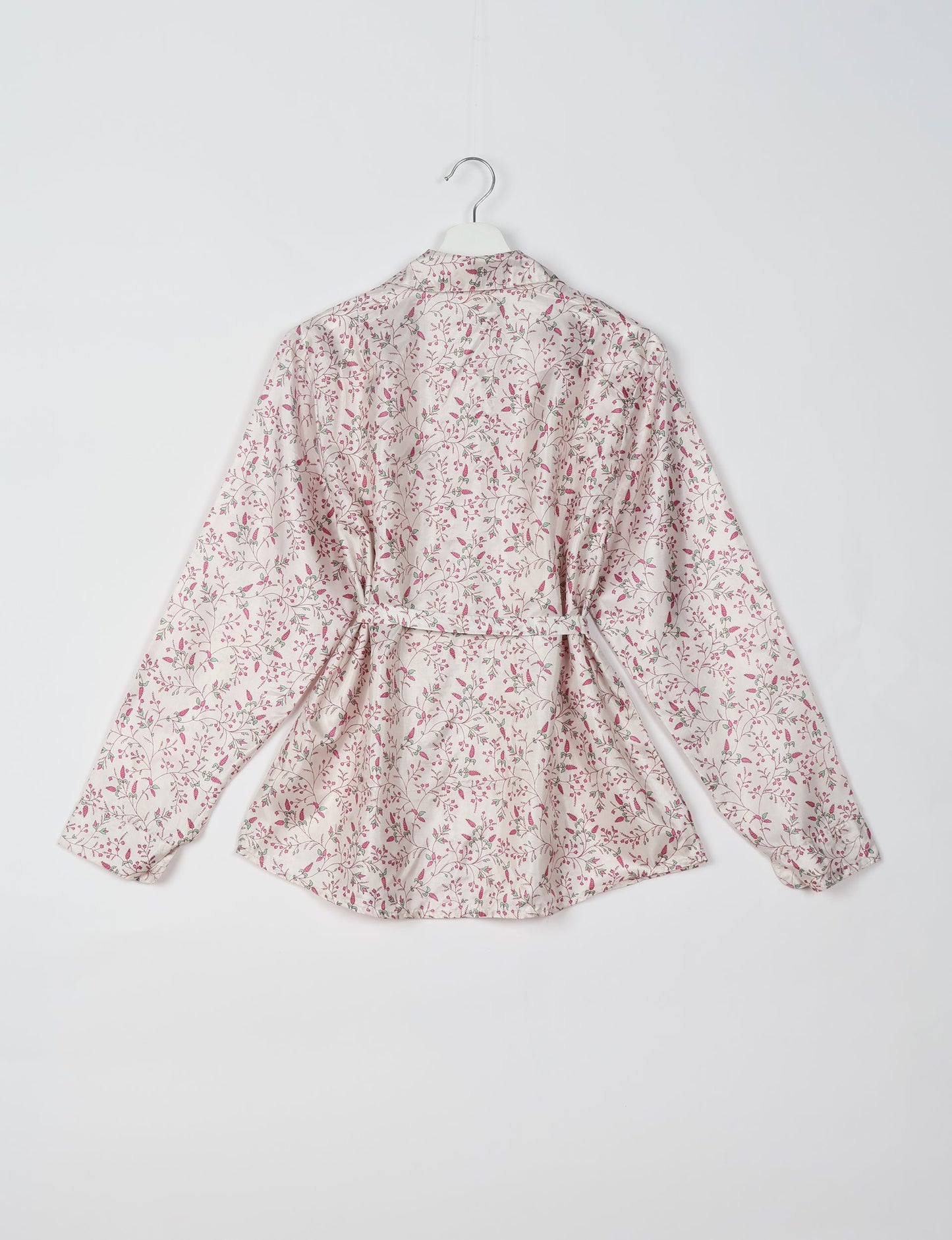 Experience sustainable fashion with our classic slim-fit shirt, crafted with ethical and green values. The shirt, designed for minimal waste, features a tie-up waist belt or neck tie, semi-spread collar, and regular shirt cuffs. Versatile and eco-friendly, wear it tucked in, unbuttoned over a tank top, or knotted at the waist for a unique style.