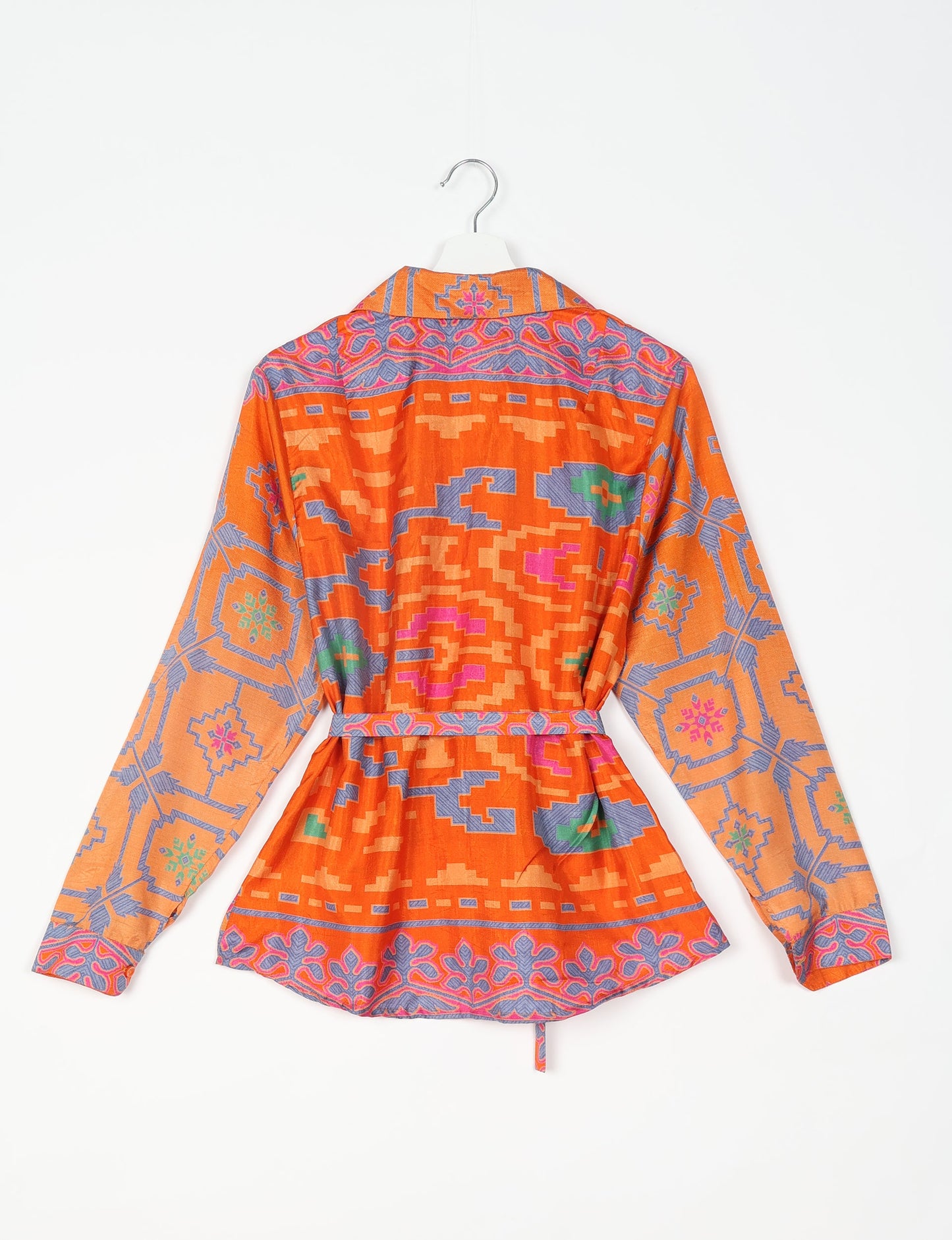 Experience sustainable fashion with our classic slim-fit shirt, crafted with ethical and green values. The shirt, designed for minimal waste, features a tie-up waist belt or neck tie, semi-spread collar, and regular shirt cuffs. Versatile and eco-friendly, wear it tucked in, unbuttoned over a tank top, or knotted at the waist for a unique style.