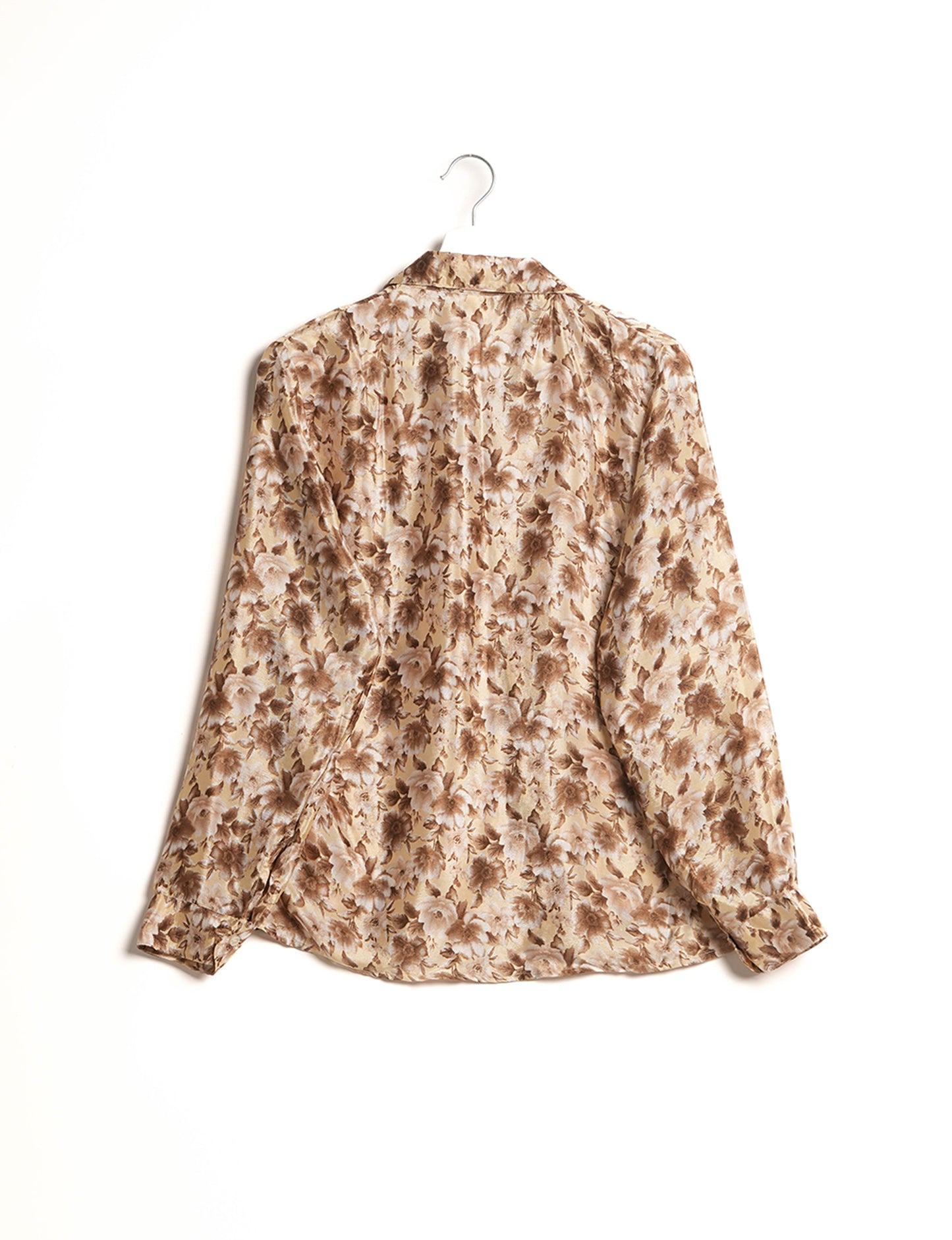 Experience sustainable fashion with our classic slim-fit shirt, crafted with ethical and green values. The shirt, designed for minimal waste, features a tie-up waist belt or neck tie, semi-spread collar, and regular shirt cuffs. Versatile and eco-friendly, wear it tucked in, unbuttoned over a tank top, or knotted at the waist for a unique style.