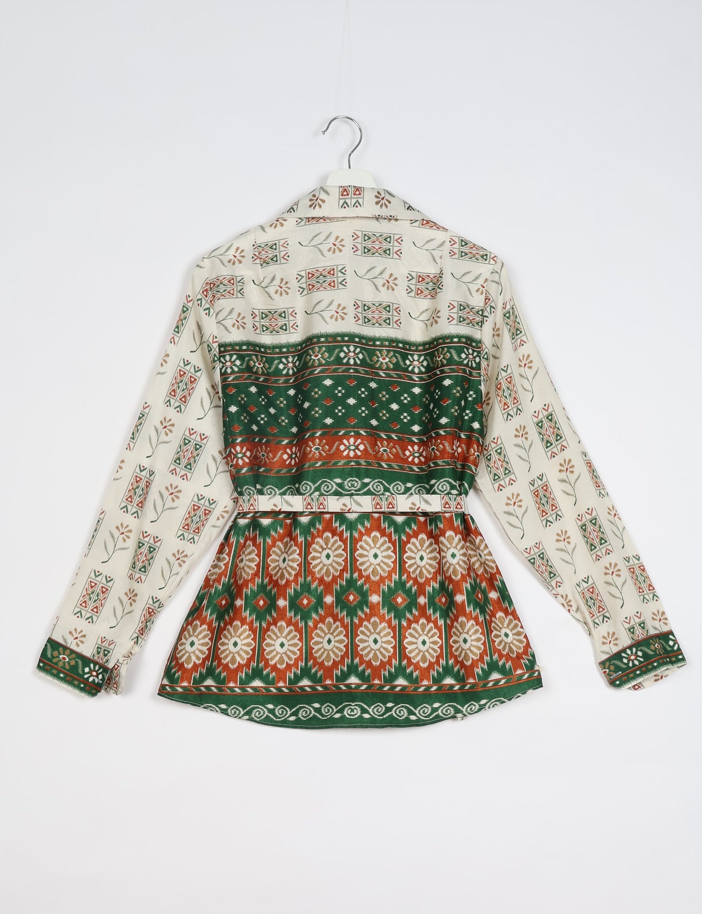 Experience sustainable fashion with our classic slim-fit shirt, crafted with ethical and green values. The shirt, designed for minimal waste, features a tie-up waist belt or neck tie, semi-spread collar, and regular shirt cuffs. Versatile and eco-friendly, wear it tucked in, unbuttoned over a tank top, or knotted at the waist for a unique style.