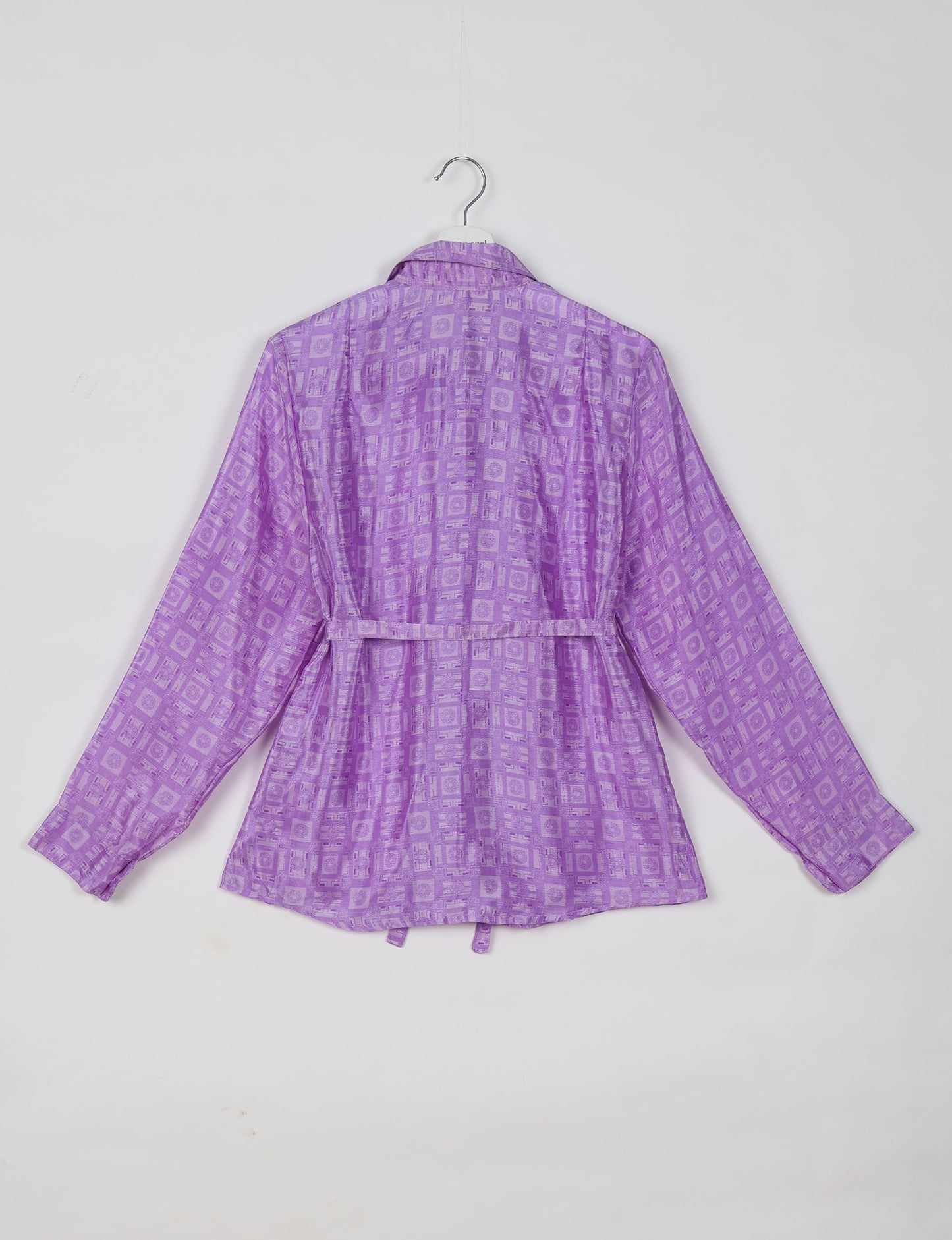 Experience sustainable fashion with our classic slim-fit shirt, crafted with ethical and green values. The shirt, designed for minimal waste, features a tie-up waist belt or neck tie, semi-spread collar, and regular shirt cuffs. Versatile and eco-friendly, wear it tucked in, unbuttoned over a tank top, or knotted at the waist for a unique style.