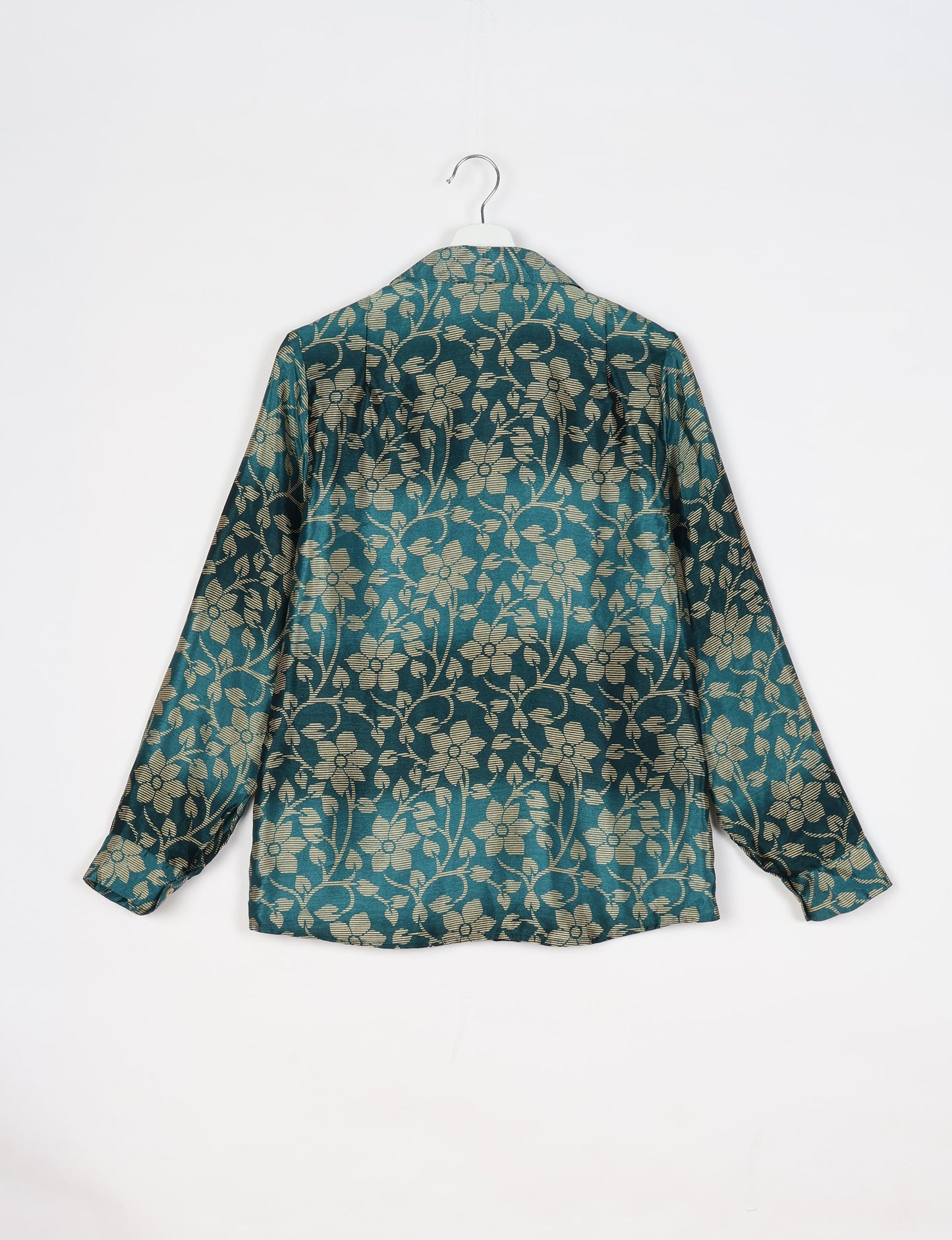 Experience sustainable fashion with our classic slim-fit shirt, crafted with ethical and green values. The shirt, designed for minimal waste, features a tie-up waist belt or neck tie, semi-spread collar, and regular shirt cuffs. Versatile and eco-friendly, wear it tucked in, unbuttoned over a tank top, or knotted at the waist for a unique style.