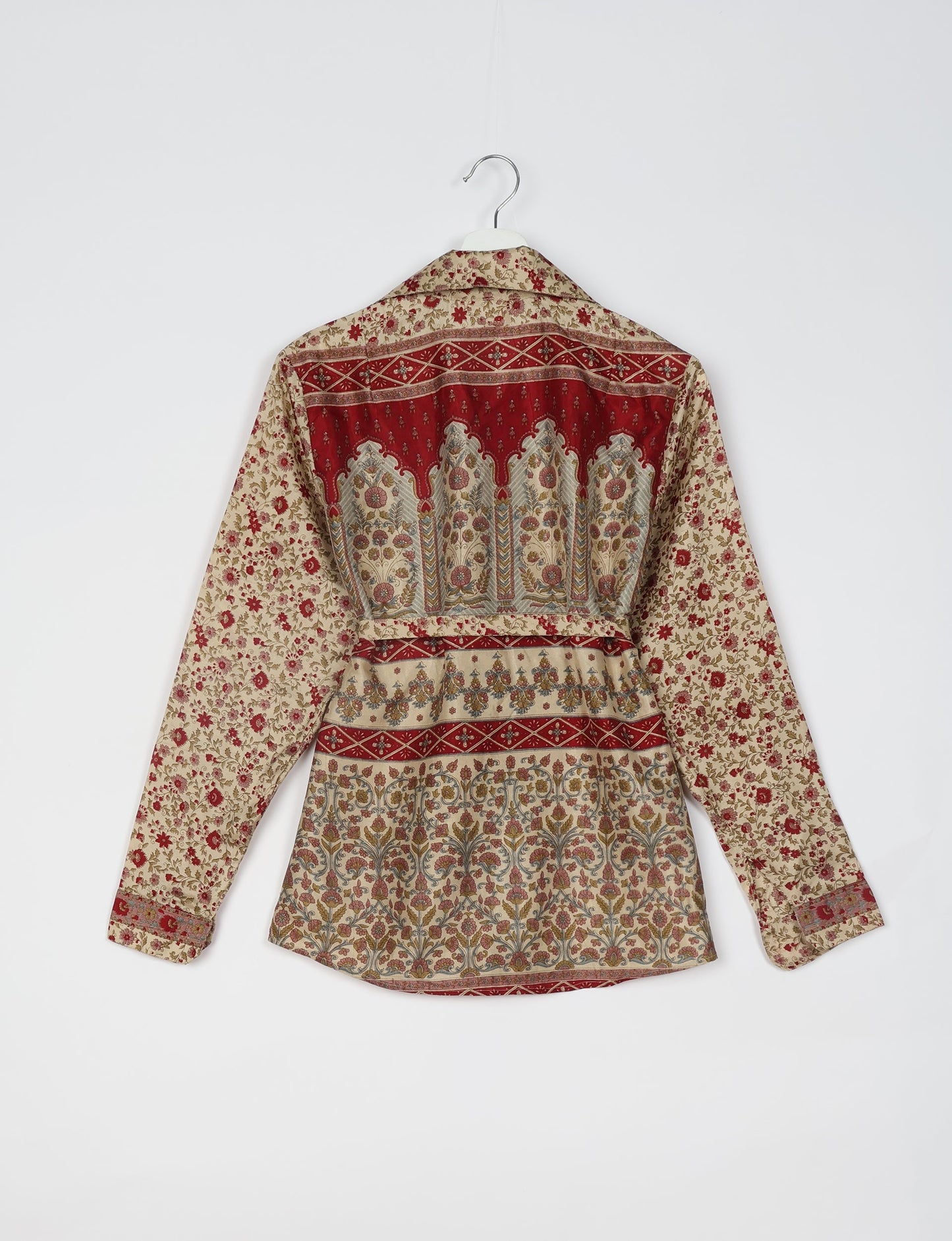 Experience sustainable fashion with our classic slim-fit shirt, crafted with ethical and green values. The shirt, designed for minimal waste, features a tie-up waist belt or neck tie, semi-spread collar, and regular shirt cuffs. Versatile and eco-friendly, wear it tucked in, unbuttoned over a tank top, or knotted at the waist for a unique style.