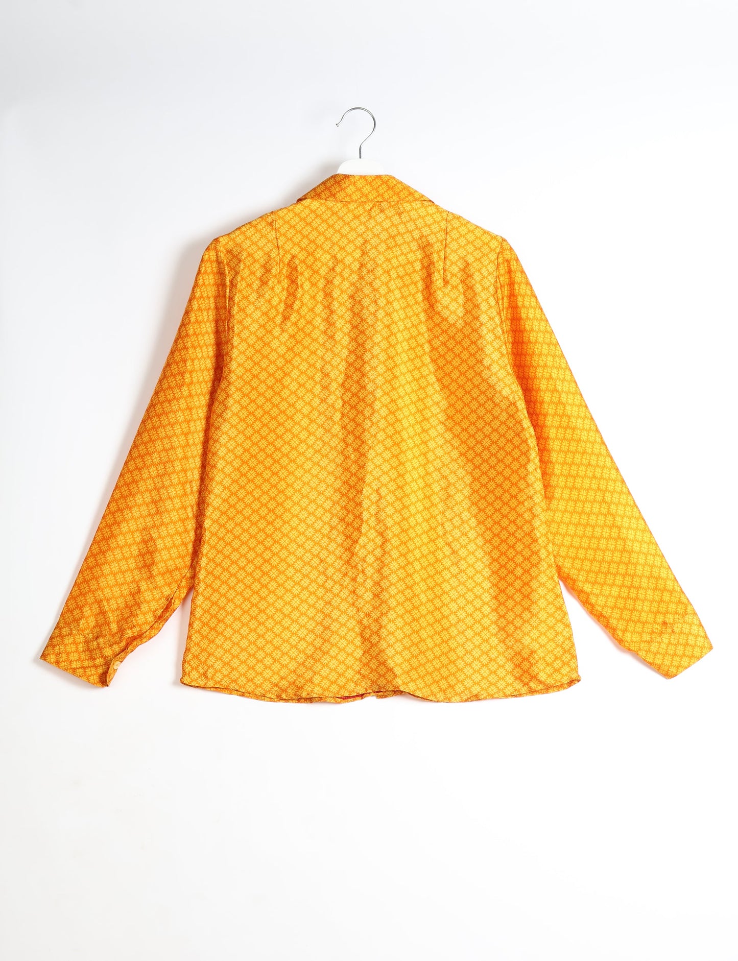 Experience sustainable fashion with our classic slim-fit shirt, crafted with ethical and green values. The shirt, designed for minimal waste, features a tie-up waist belt or neck tie, semi-spread collar, and regular shirt cuffs. Versatile and eco-friendly, wear it tucked in, unbuttoned over a tank top, or knotted at the waist for a unique style.