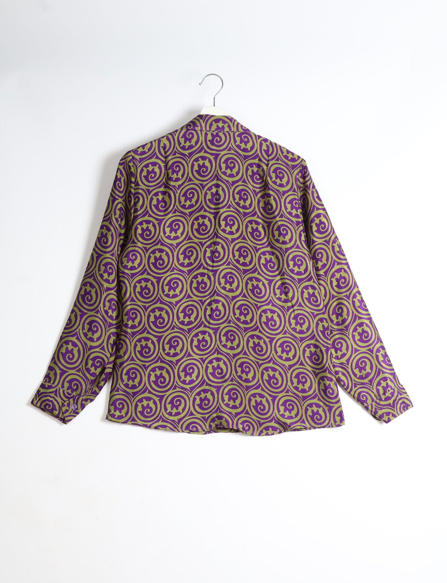 Experience sustainable fashion with our classic slim-fit shirt, crafted with ethical and green values. The shirt, designed for minimal waste, features a tie-up waist belt or neck tie, semi-spread collar, and regular shirt cuffs. Versatile and eco-friendly, wear it tucked in, unbuttoned over a tank top, or knotted at the waist for a unique style.