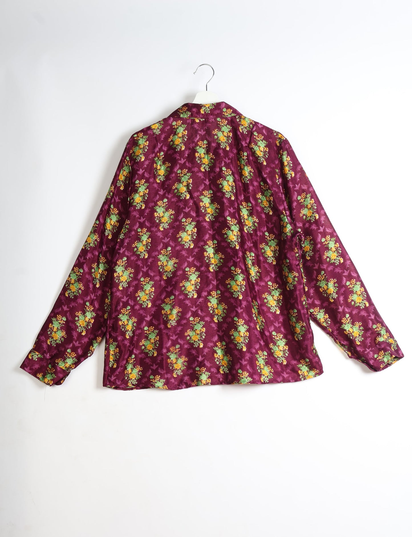 Experience sustainable fashion with our classic slim-fit shirt, crafted with ethical and green values. The shirt, designed for minimal waste, features a tie-up waist belt or neck tie, semi-spread collar, and regular shirt cuffs. Versatile and eco-friendly, wear it tucked in, unbuttoned over a tank top, or knotted at the waist for a unique style.