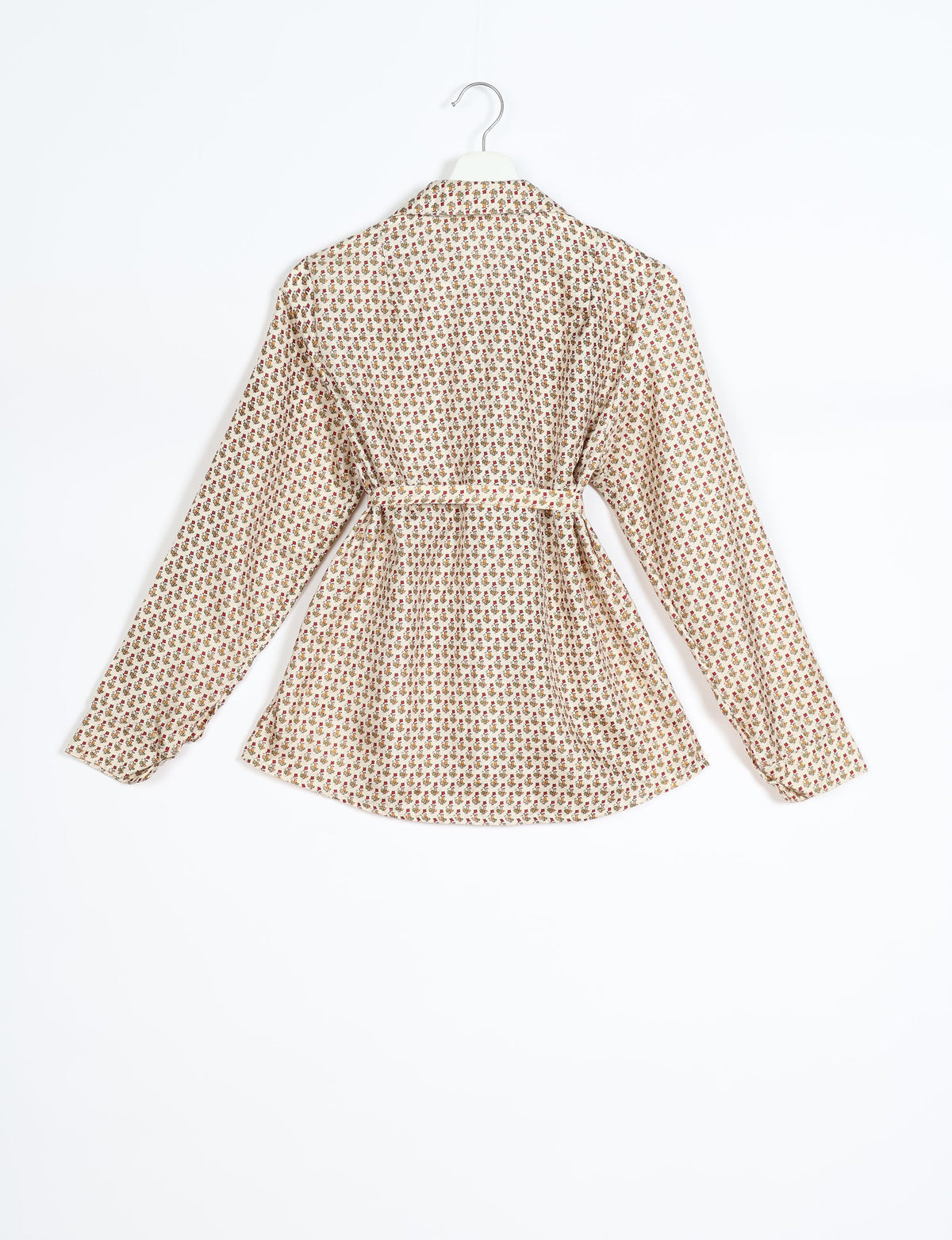 Experience sustainable fashion with our classic slim-fit shirt, crafted with ethical and green values. The shirt, designed for minimal waste, features a tie-up waist belt or neck tie, semi-spread collar, and regular shirt cuffs. Versatile and eco-friendly, wear it tucked in, unbuttoned over a tank top, or knotted at the waist for a unique style.