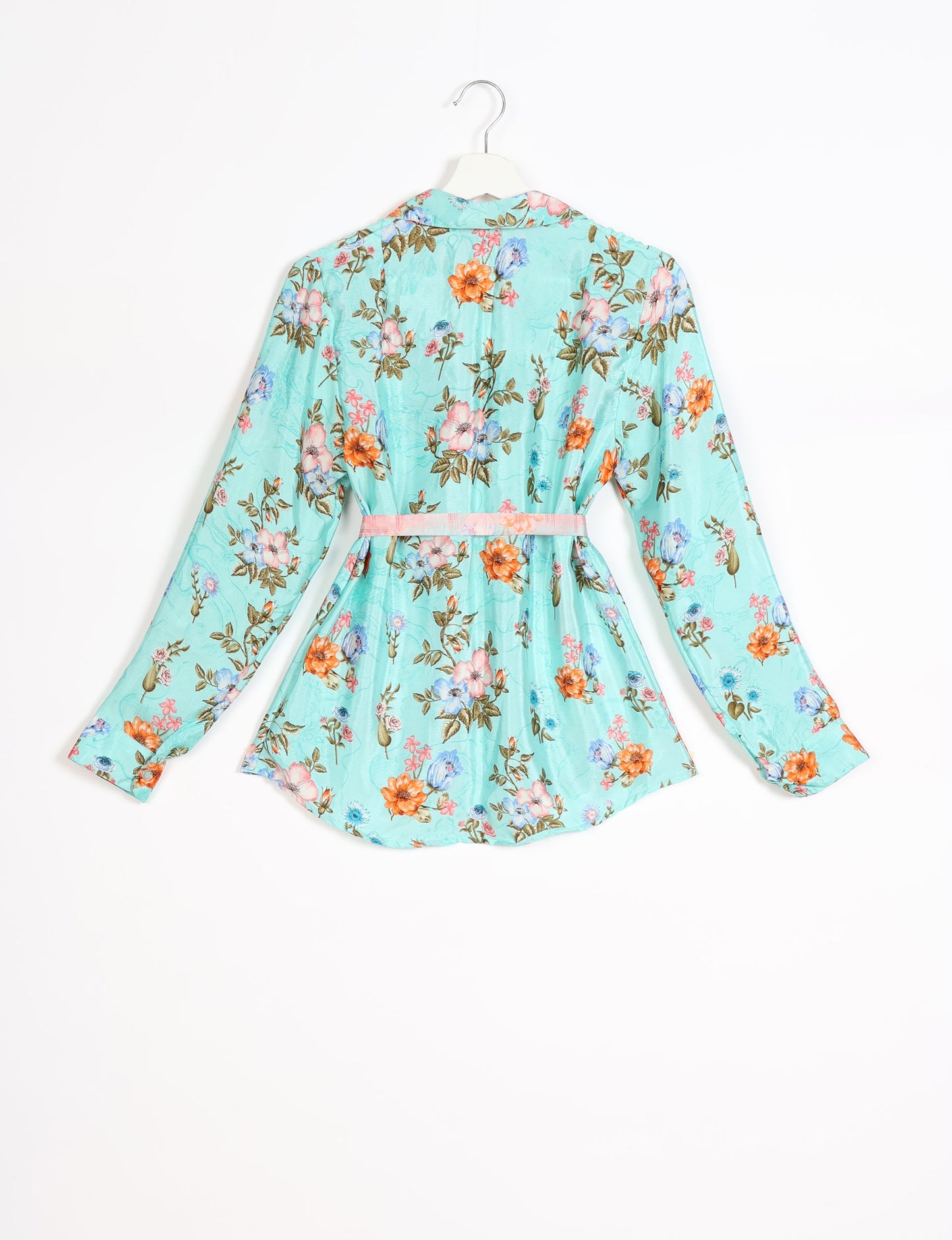 Experience sustainable fashion with our classic slim-fit shirt, crafted with ethical and green values. The shirt, designed for minimal waste, features a tie-up waist belt or neck tie, semi-spread collar, and regular shirt cuffs. Versatile and eco-friendly, wear it tucked in, unbuttoned over a tank top, or knotted at the waist for a unique style.