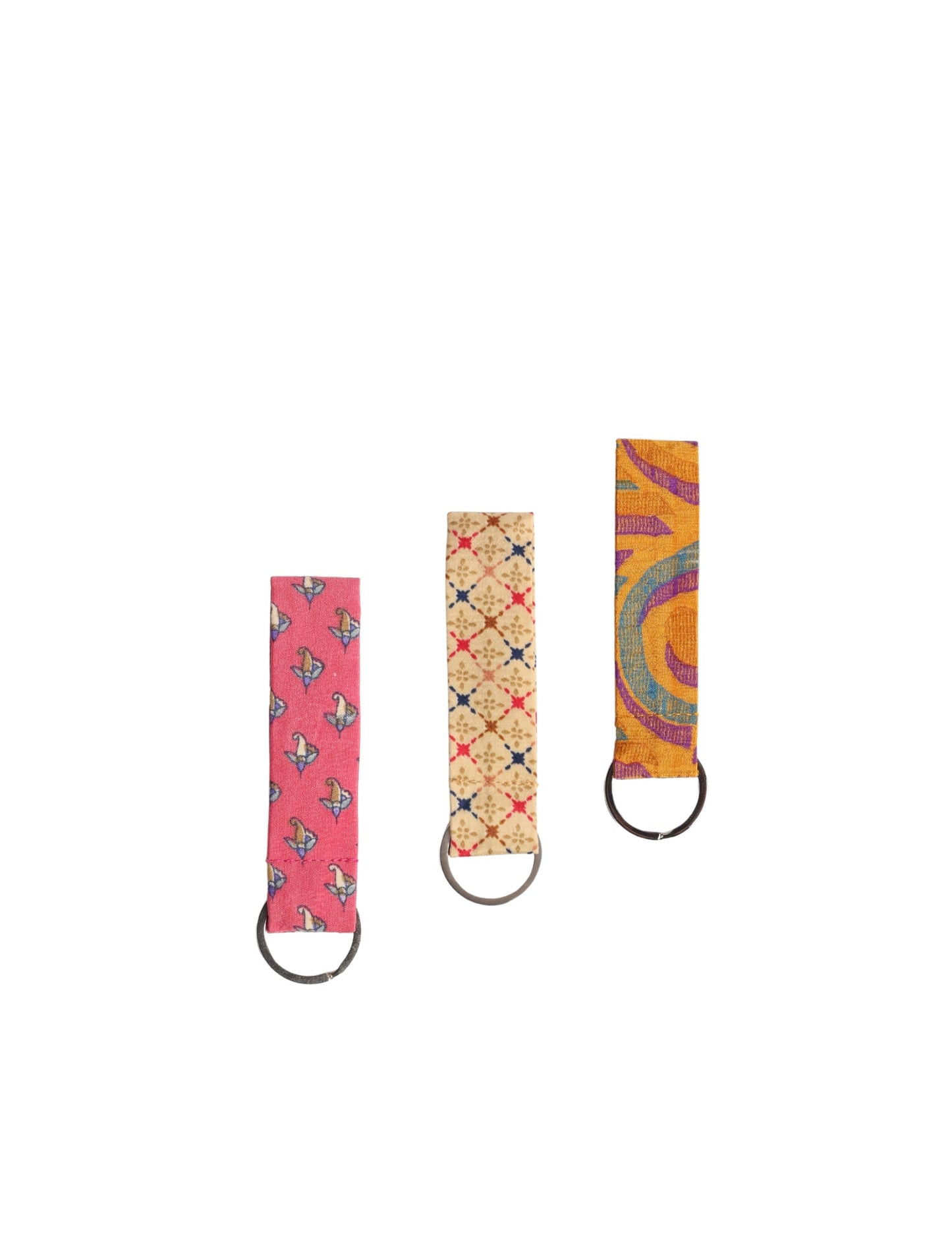 Upcycled sari fabric key ring with metal loop, made from recycled materials, promoting eco friendly fashion, sustainable apparel, zero waste clothing, climate neutral fashion, and environmentally friendly clothing.