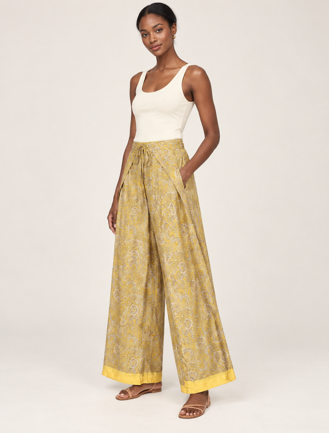 Immerse yourself in the vibrant allure of our PANTA PAREO – a distinctive piece made from handpicked, pre-worn saris, and carefully reworked by local artisans. This pareo is more than just a getaway must-have; it's a sustainable statement. Ideal as a layer over a bikini or a stylish throw, it brings eco-friendly charm to any room in your home. Embrace the colorful elegance of repurposed saris with the PANTA PAREO – an essential addition to your wardrobe for conscious and stylish living.