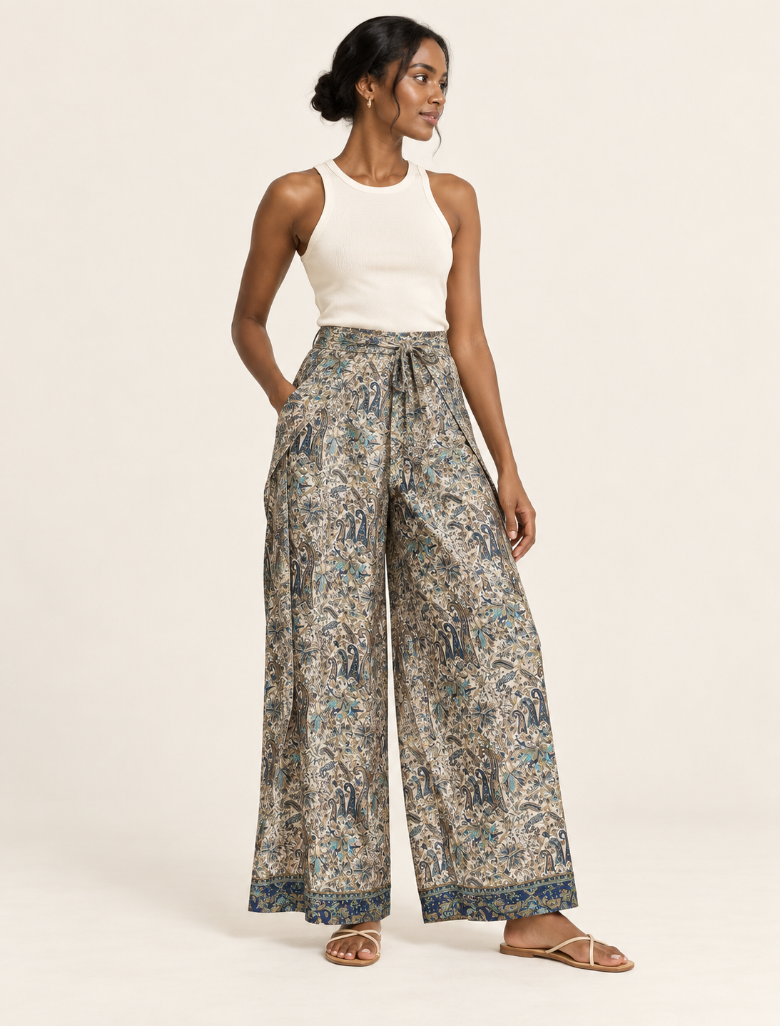 Immerse yourself in the vibrant allure of our PANTA PAREO – a distinctive piece made from handpicked, pre-worn saris, and carefully reworked by local artisans. This pareo is more than just a getaway must-have; it's a sustainable statement. Ideal as a layer over a bikini or a stylish throw, it brings eco-friendly charm to any room in your home. Embrace the colorful elegance of repurposed saris with the PANTA PAREO – an essential addition to your wardrobe for conscious and stylish living.