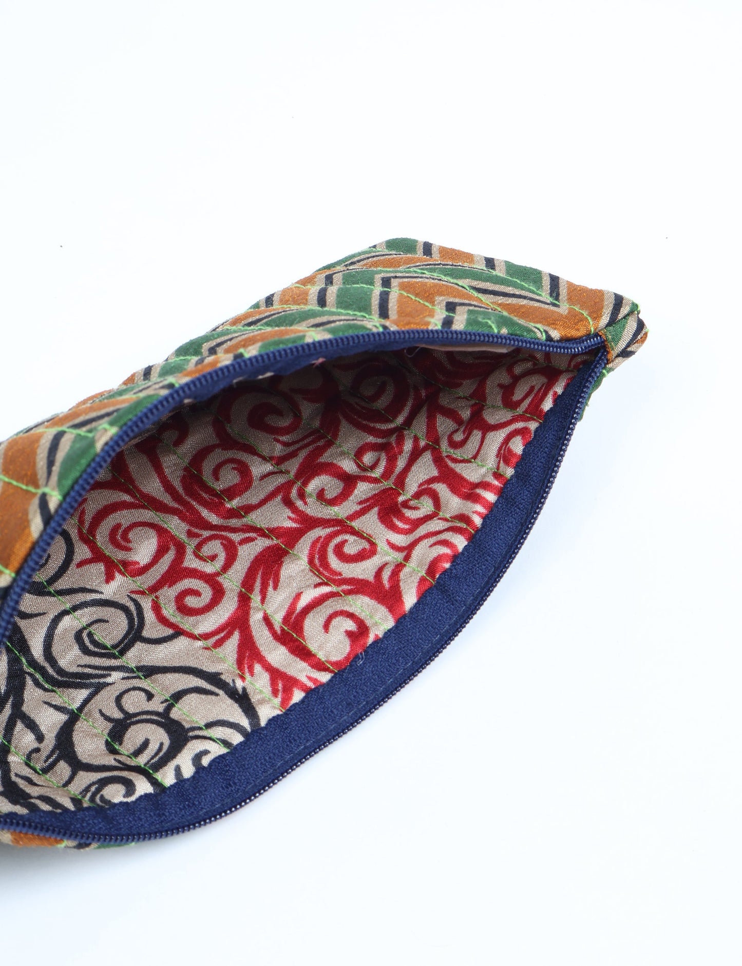 Quilted pencil pouch made from recycled clothing and repurposed textiles, promoting eco friendly fashion and circular fashion ideals. A durable, stylish storage option inspired by recycled sari products, upcycled women’s clothing, and earth friendly fashion practices.
