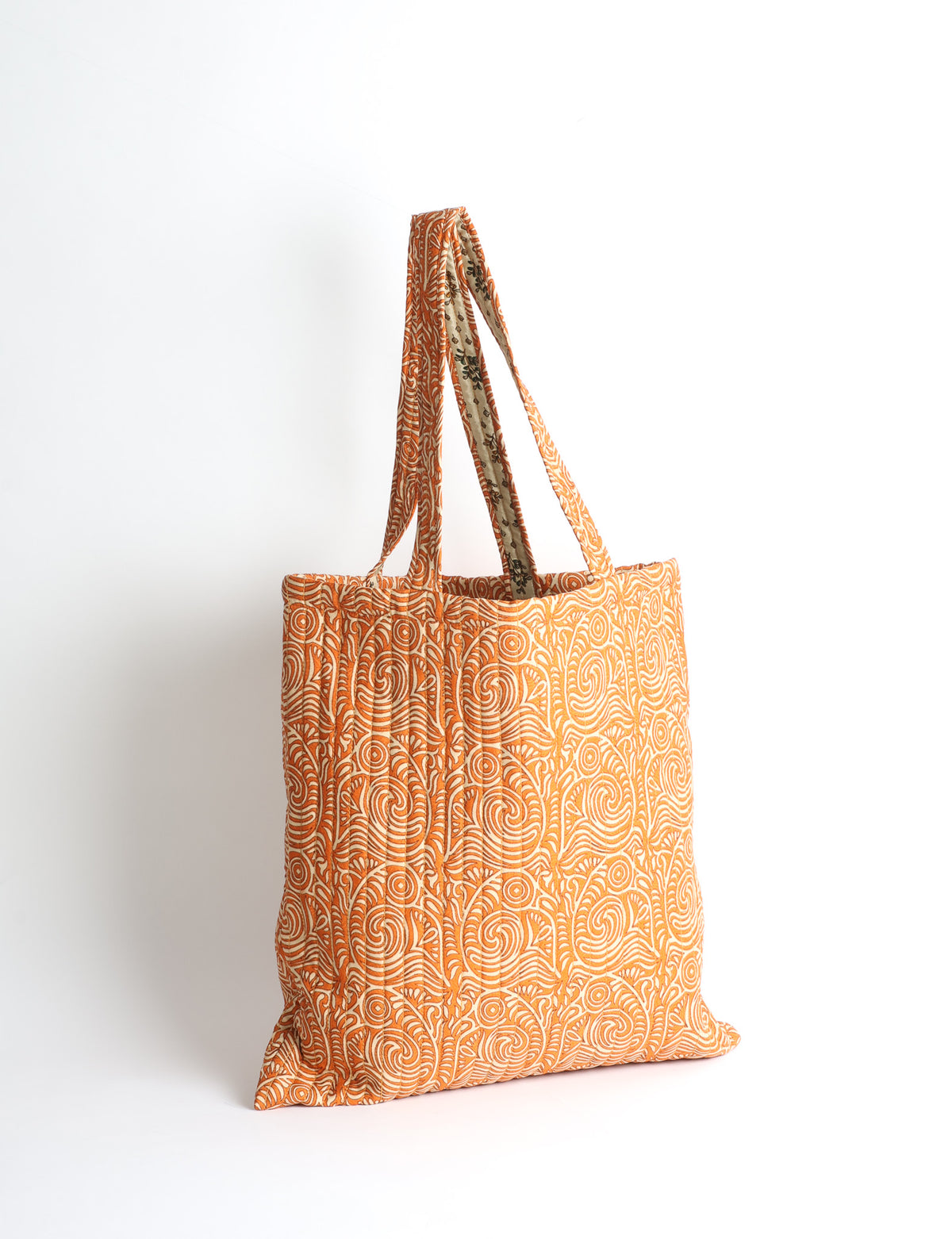 Elevate your style sustainably with our QUILTED SHOPPER BAG. Soft textures, vibrant colors, and a positive impact on people and the planet. Perfect for the office, shopping, or happy hour. Crafted from pre-loved saris for eco-conscious fashionistas!