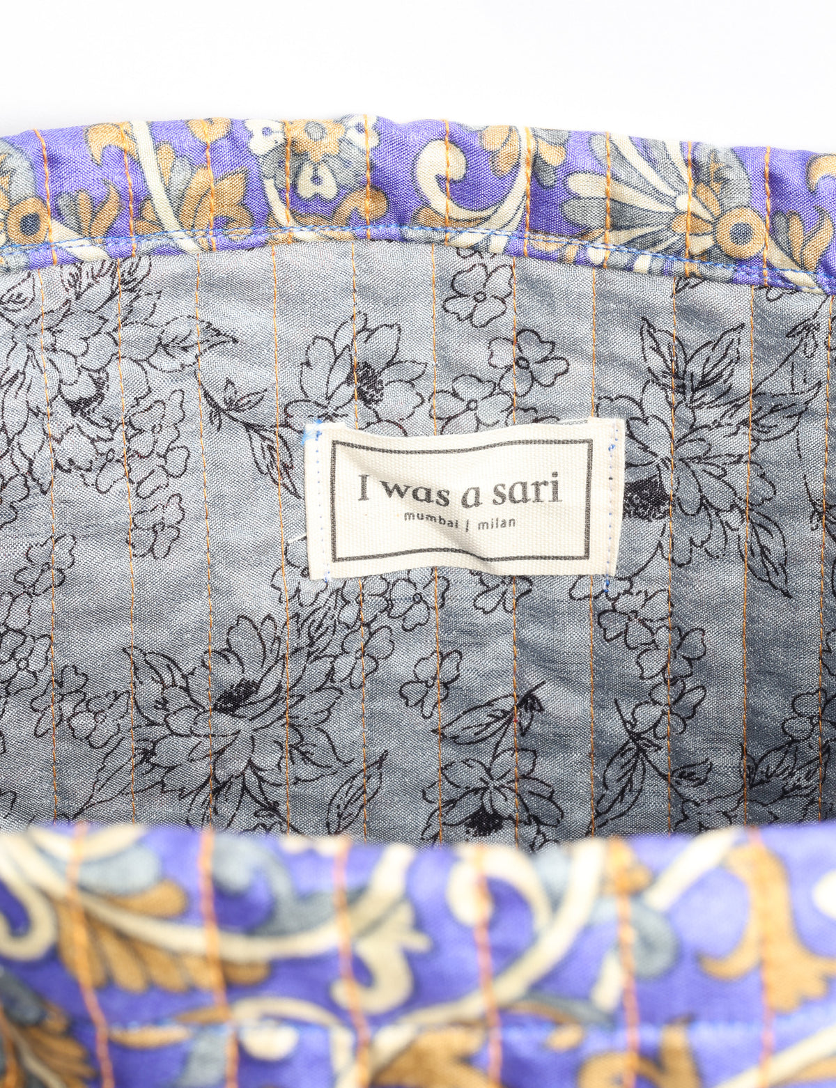 Elevate your style sustainably with our QUILTED SHOPPER BAG. Soft textures, vibrant colors, and a positive impact on people and the planet. Perfect for the office, shopping, or happy hour. Crafted from pre-loved saris for eco-conscious fashionistas!