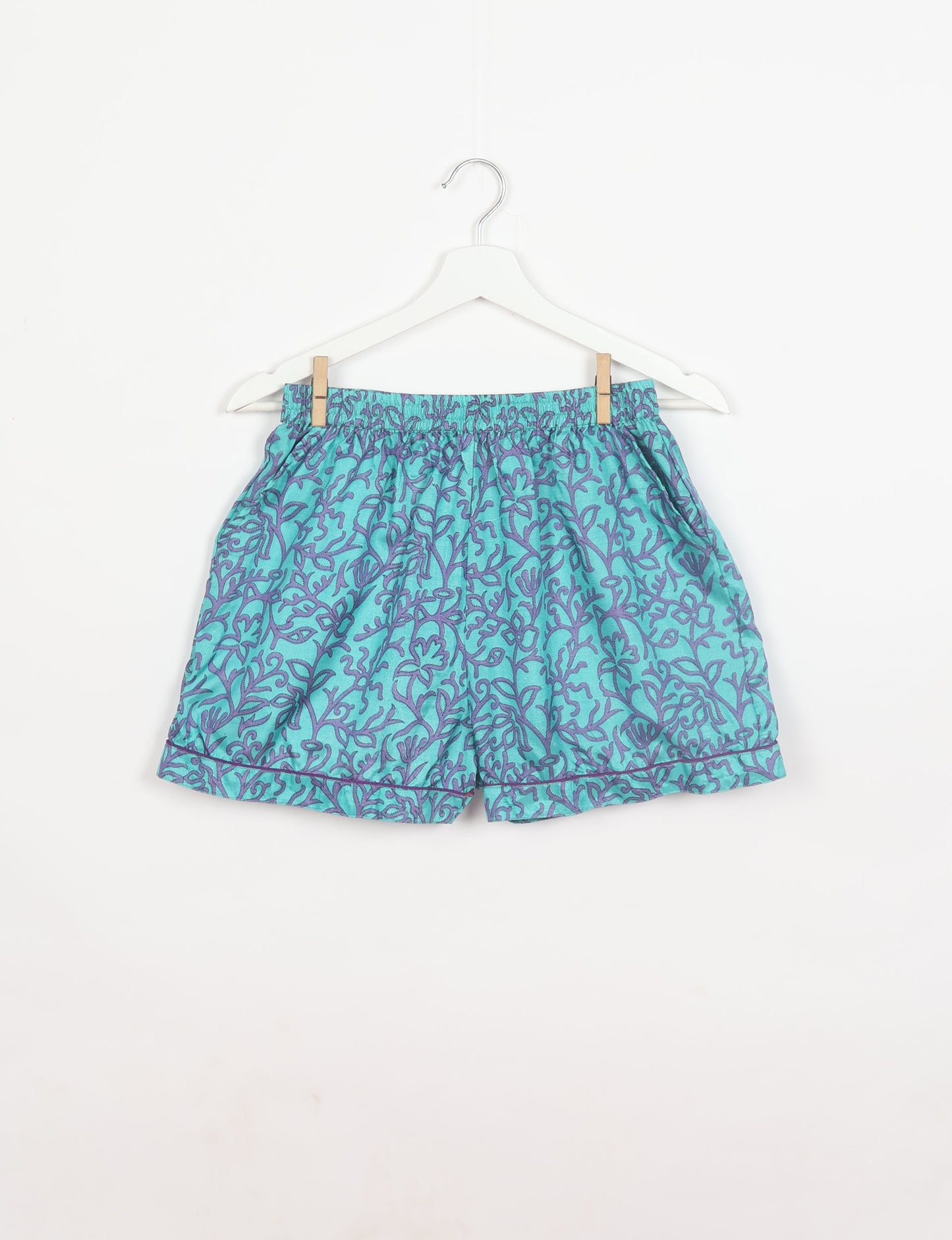 Indulge in comfort and style with our PJ Set Short, now with short sleeves. Crafted from upcycled saris, these shorts embody a zero-waste mentality for sustainable sleepwear. Versatile from day to night, perfect for beach lounging or poolside yoga, these pajamas redefine conscious fashion.