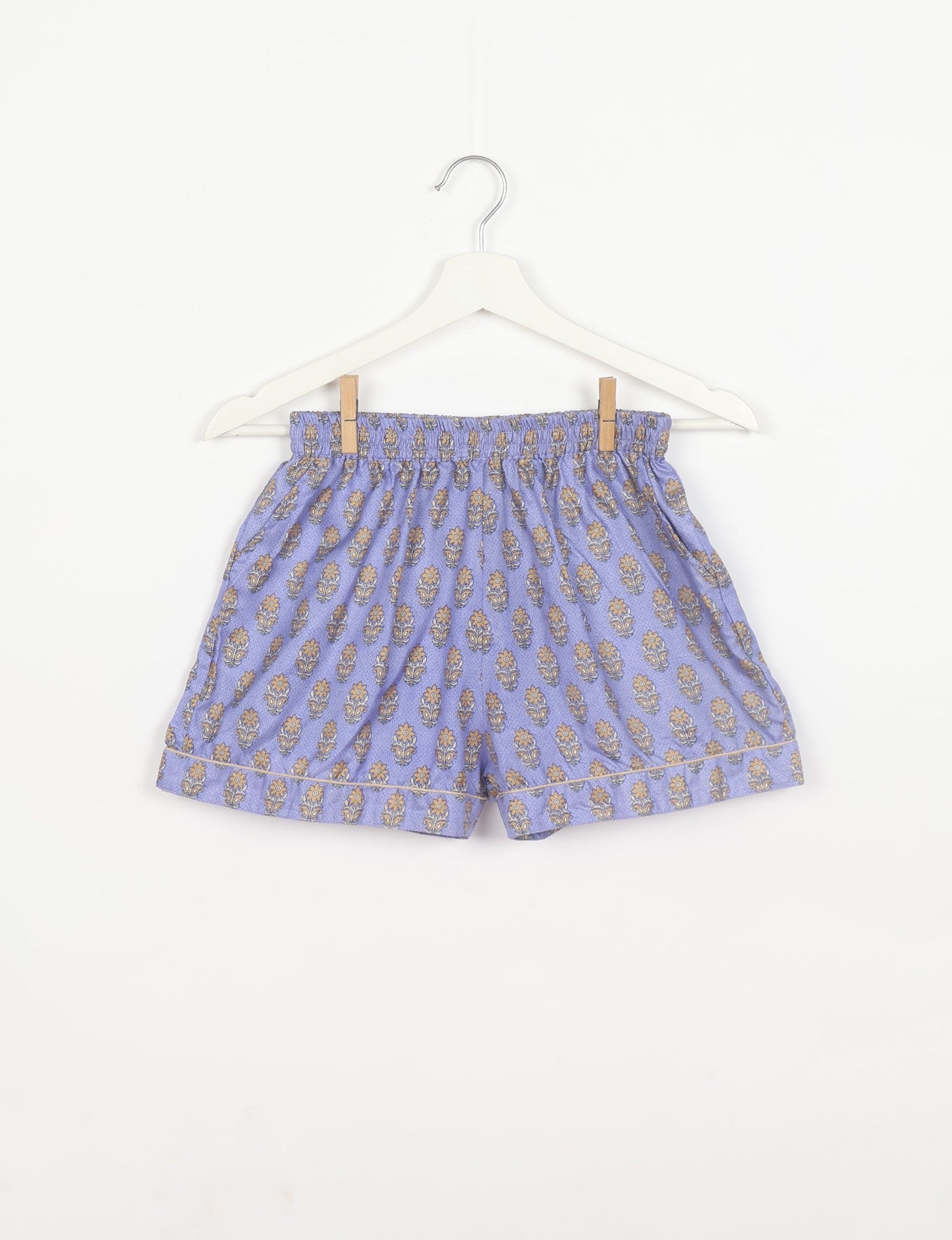 Indulge in comfort and style with our PJ Set Short, now with short sleeves. Crafted from upcycled saris, these shorts embody a zero-waste mentality for sustainable sleepwear. Versatile from day to night, perfect for beach lounging or poolside yoga, these pajamas redefine conscious fashion.