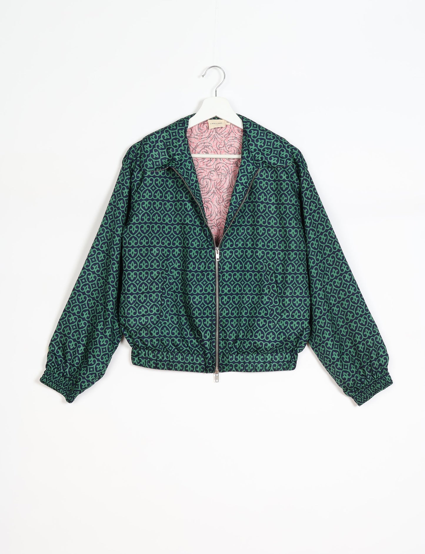 Stylish BOMBER JACKET, an upcycled clothing masterpiece with a cute cropped shape, elasticated details, and detachable metallic zipper. Contrast sari print lining adds a unique touch. Explore sustainable and eco-friendly fashion.
