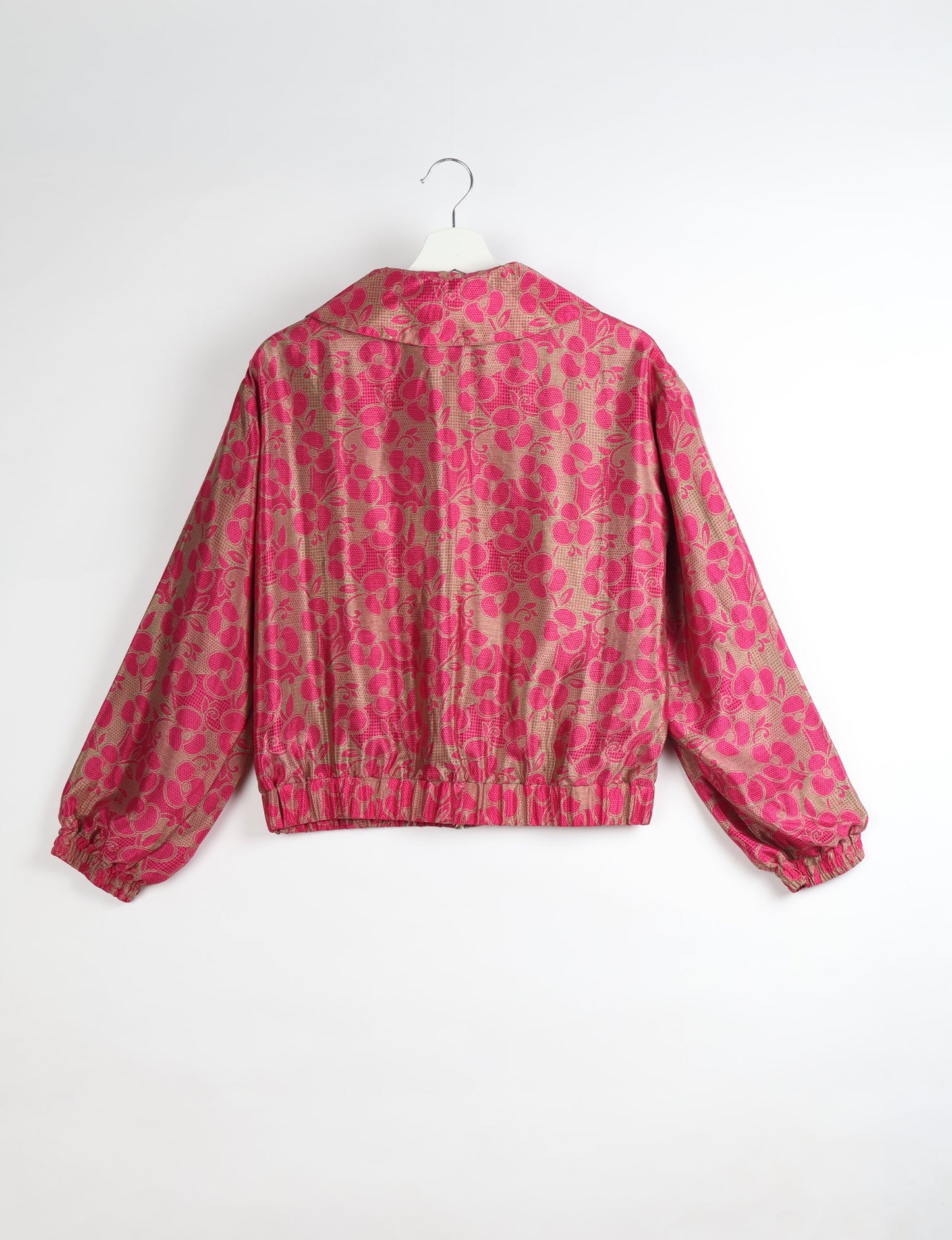Upcycled Bomber Jacket made from recycled sari materials, featuring a cute cropped shape, elasticated hem and cuffs, and contrast sari print lining. Sustainable apparel promoting eco-friendly fashion and ethical clothing.