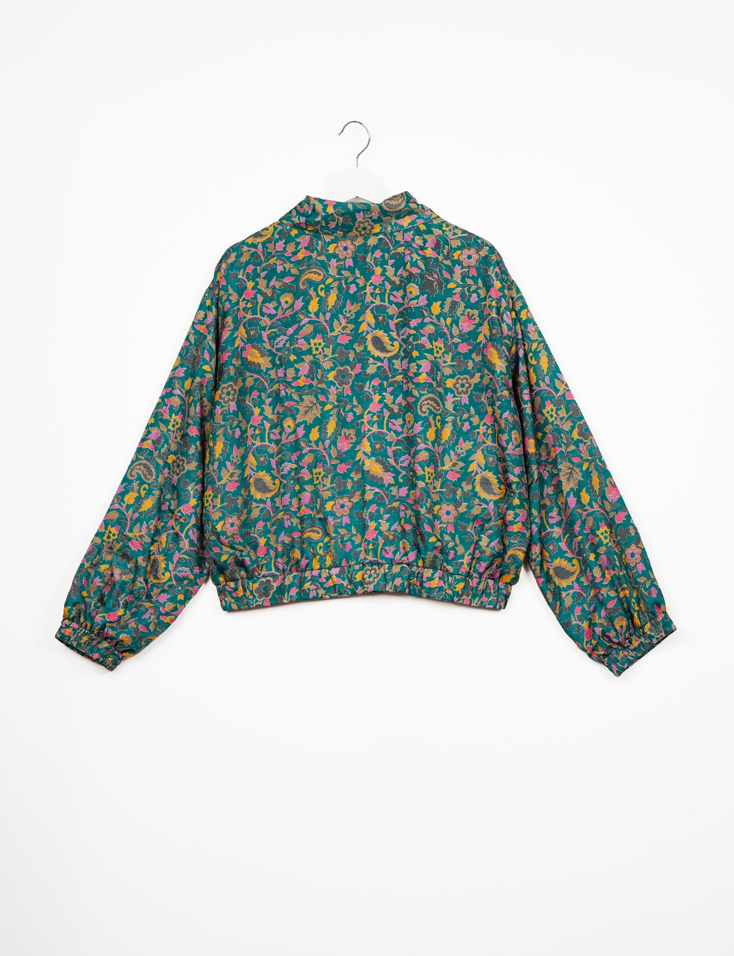 Stylish BOMBER JACKET, an upcycled clothing masterpiece with a cute cropped shape, elasticated details, and detachable metallic zipper. Contrast sari print lining adds a unique touch. Explore sustainable and eco-friendly fashion.