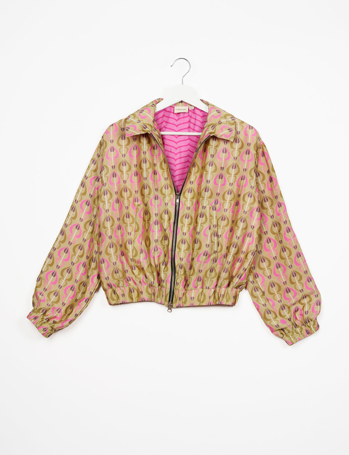Stylish BOMBER JACKET, an upcycled clothing masterpiece with a cute cropped shape, elasticated details, and detachable metallic zipper. Contrast sari print lining adds a unique touch. Explore sustainable and eco-friendly fashion.