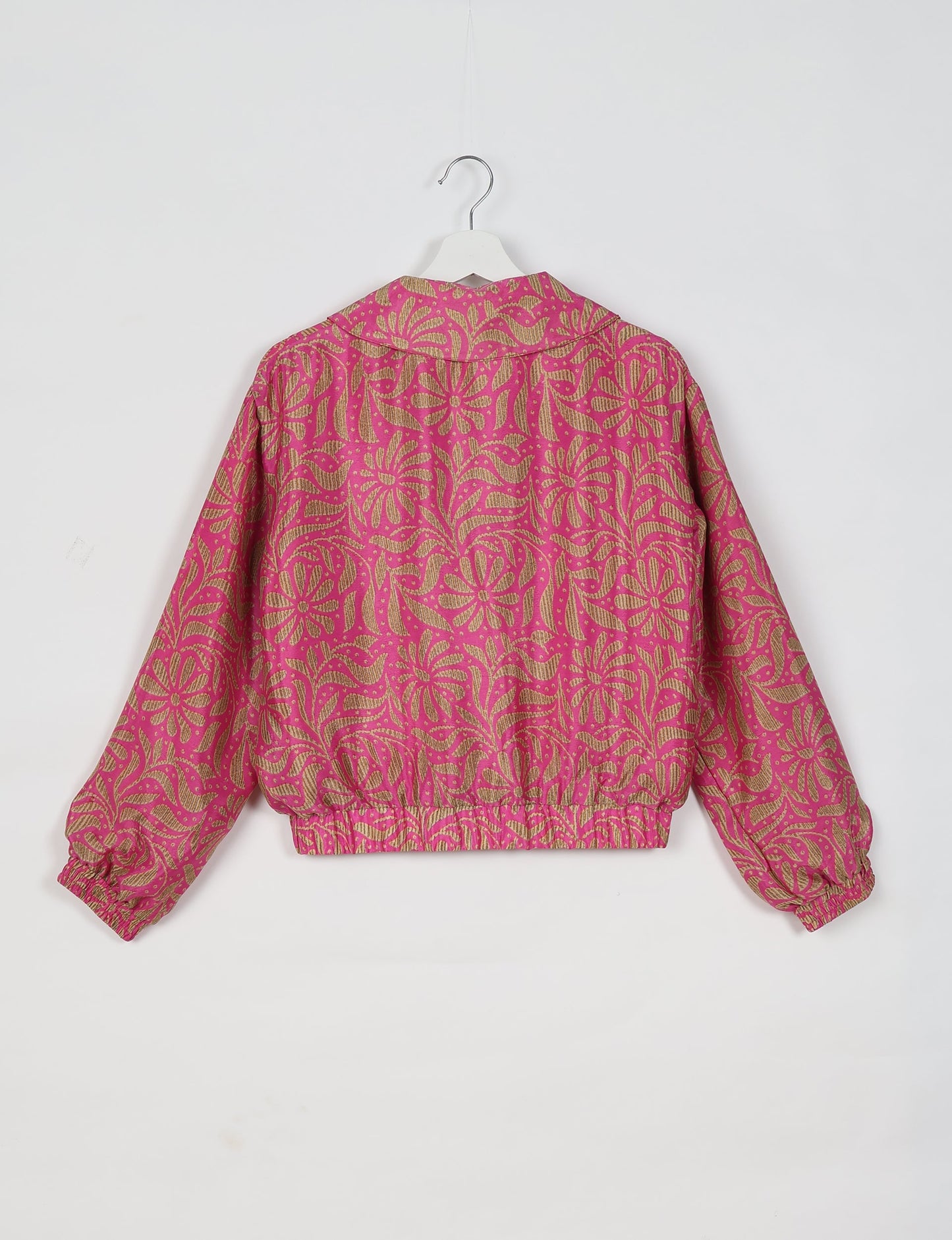 Upcycled Bomber Jacket made from recycled sari materials, featuring a cute cropped shape, elasticated hem and cuffs, and contrast sari print lining. Sustainable apparel promoting eco-friendly fashion and ethical clothing.