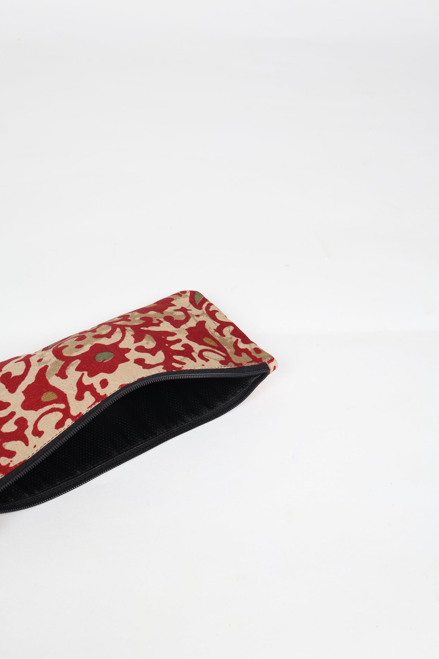 Eco-conscious quilted pencil pouch with waterproof lining made from upcycled garments, reflecting the values of circular fashion, carbon neutral fashion, and repurposed clothing. A perfect example of green fashion and sustainable women's clothing.