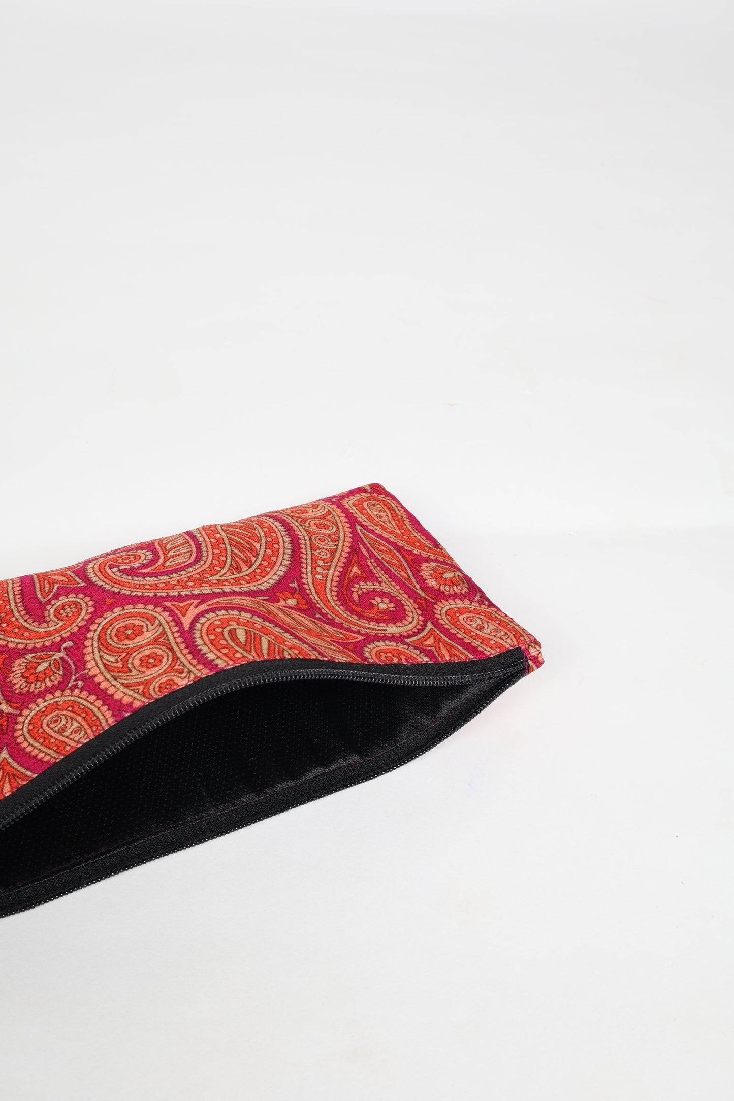Eco-conscious quilted pencil pouch with waterproof lining made from upcycled garments, reflecting the values of circular fashion, carbon neutral fashion, and repurposed clothing. A perfect example of green fashion and sustainable women's clothing.